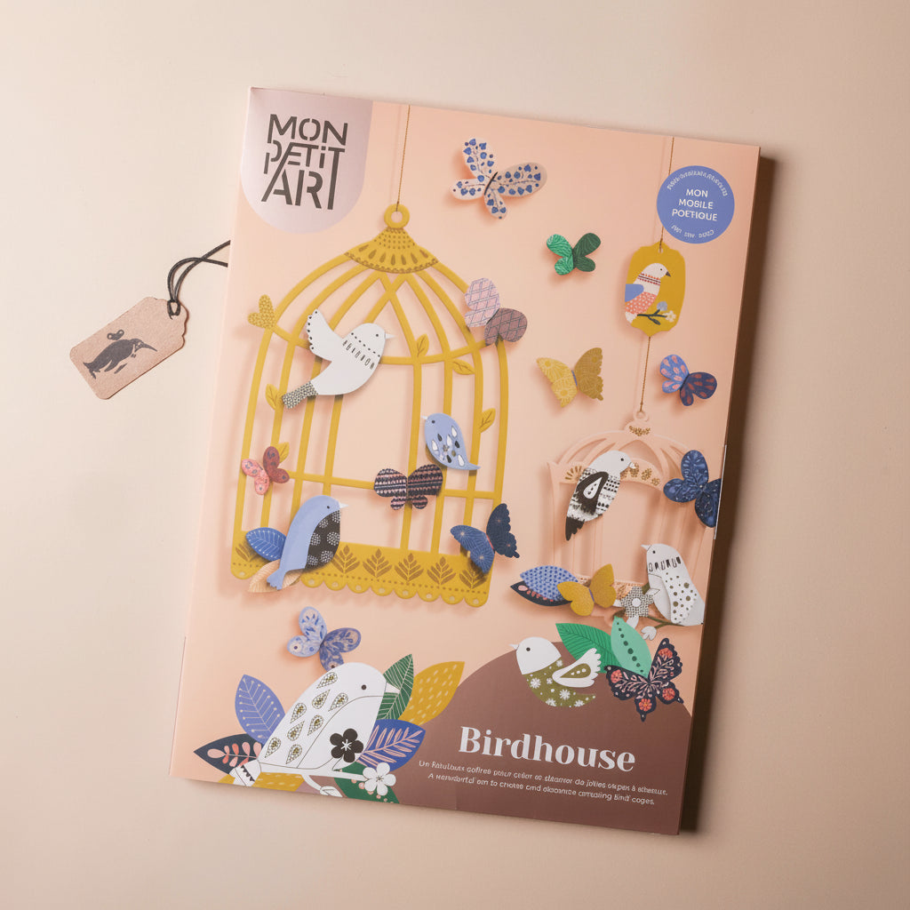 Packaging of 'Mon Petit Art' birdhouse and butterfly craft set on a beige background