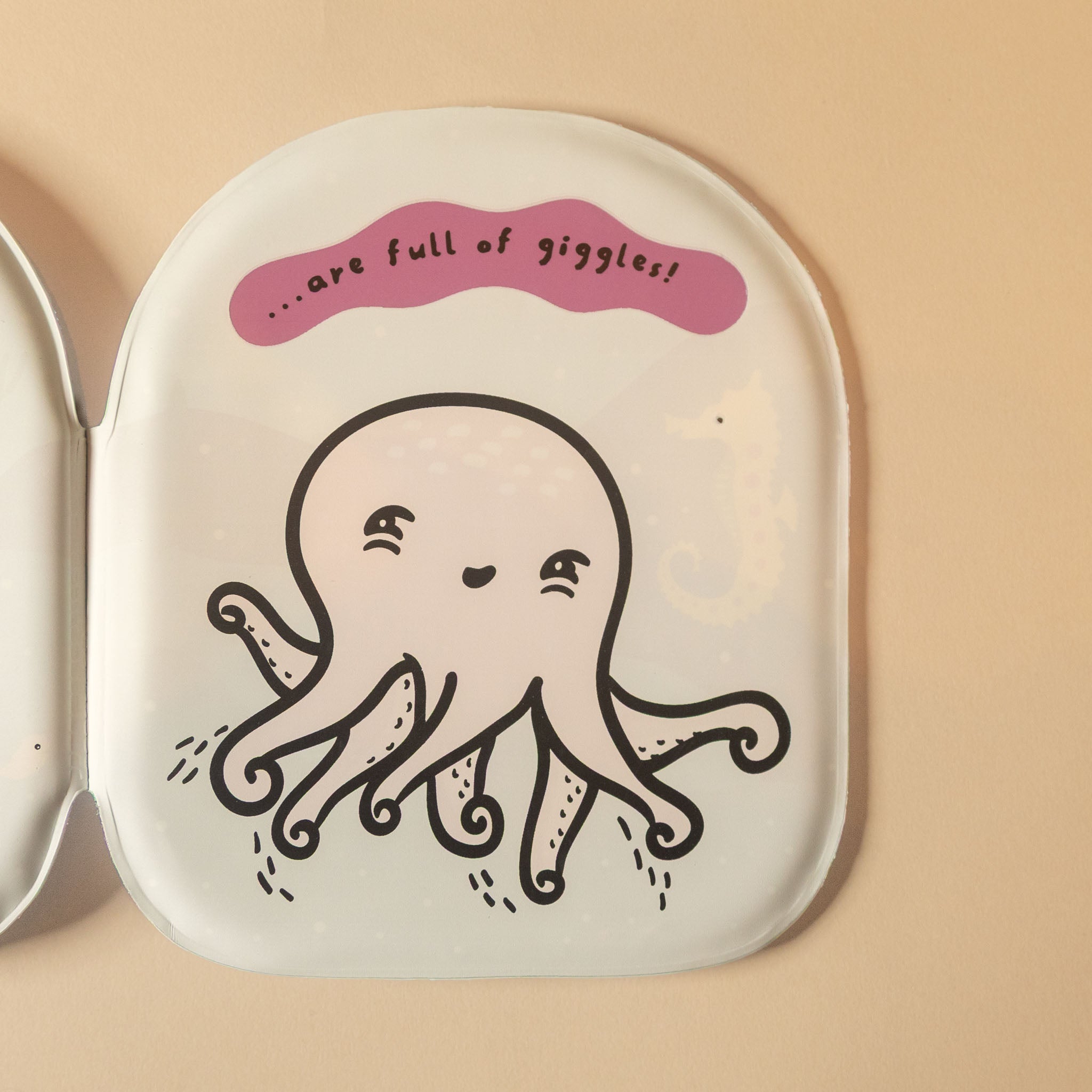 A close-up of a white octopus-friends-bath-book rounded corners, featuring a cute cartoon octopus with black outlines and a pink speech bubble that reads 'are full of giggles'.
