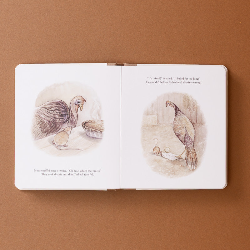 An open children's picture book with two illustrated pages, photographed from above on a warm brown background. The pages show watercolor-style drawings of a turkey and a chicken with small chicks, plus printed text.