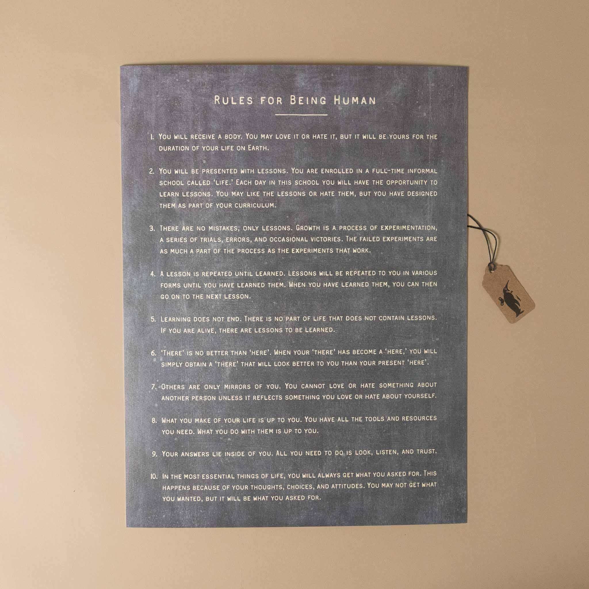 Rules for Being Human poster on a beige wall