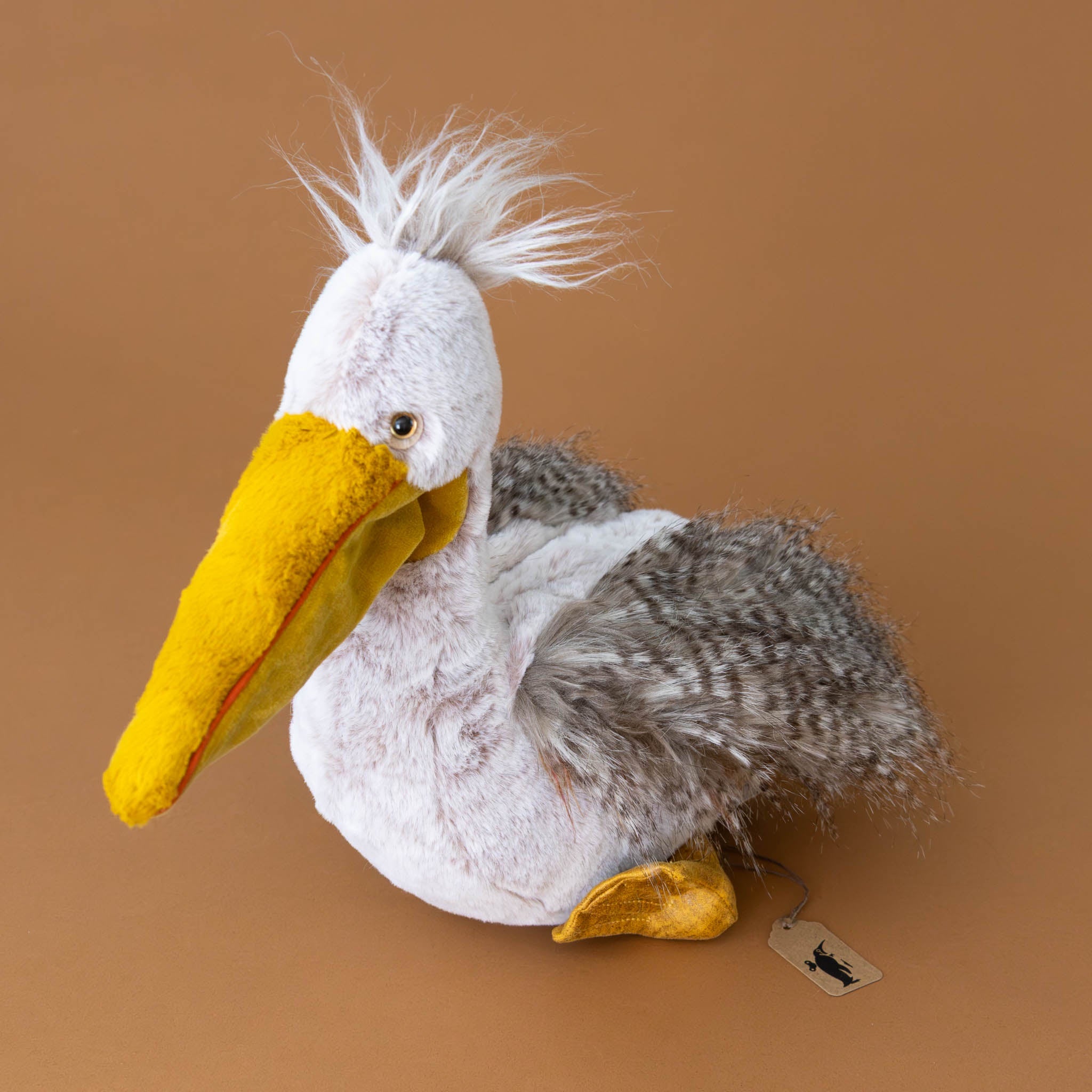 peculiar-pelican-stuffed-animal-with-soft-grey-feathery-fur-and-yellow-beak-and-feet