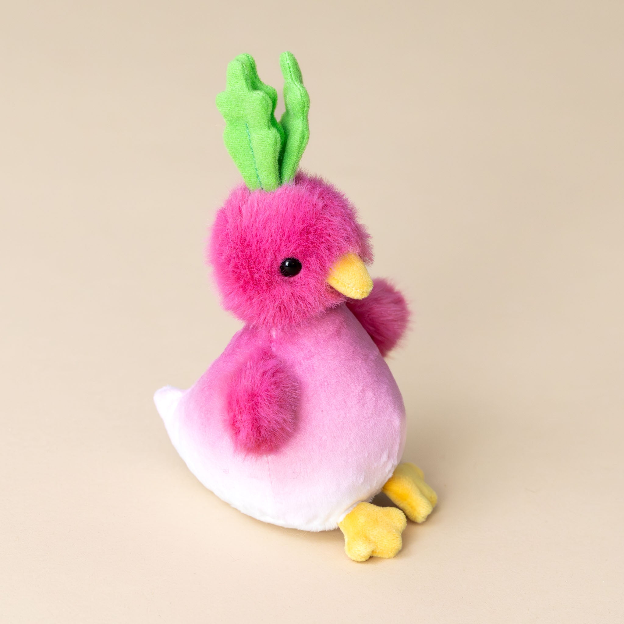 petite-radichick-pink-white-bird-with-green-leafy-crown-and-yellow-feet-and-beak-side