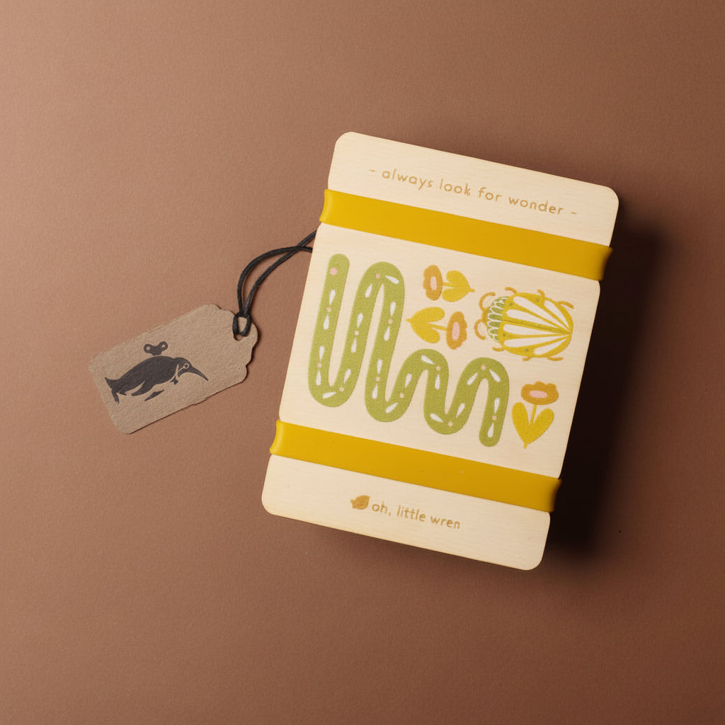 petite-wooden-flower-press-snake with floral design and text on a brown background