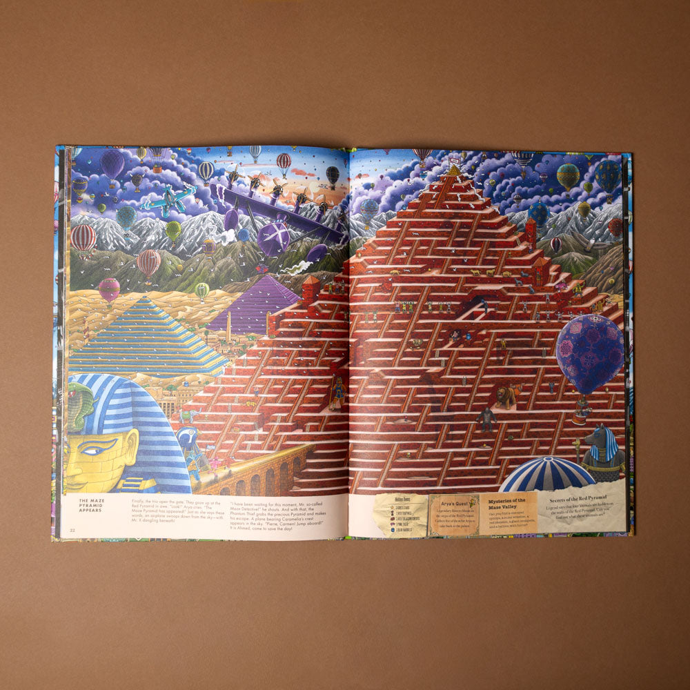 pierre-the-maze-detective-the-hunt-for-the-maze-pyramid Open book with colorful illustrations of a pyramid and other geometric shapes on a brown background