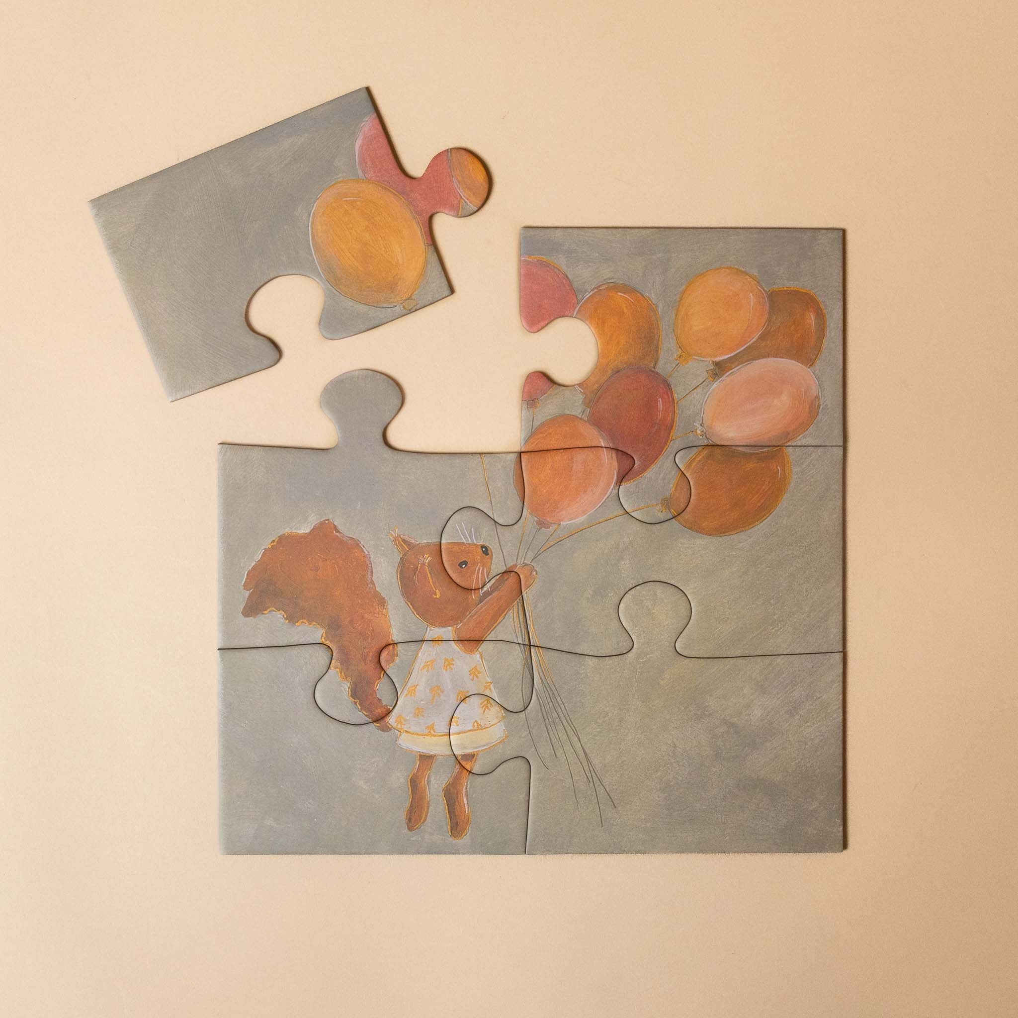 progressive-puzzle-set-woodland-friends Jigsaw puzzle with a child holding balloons on a beige background