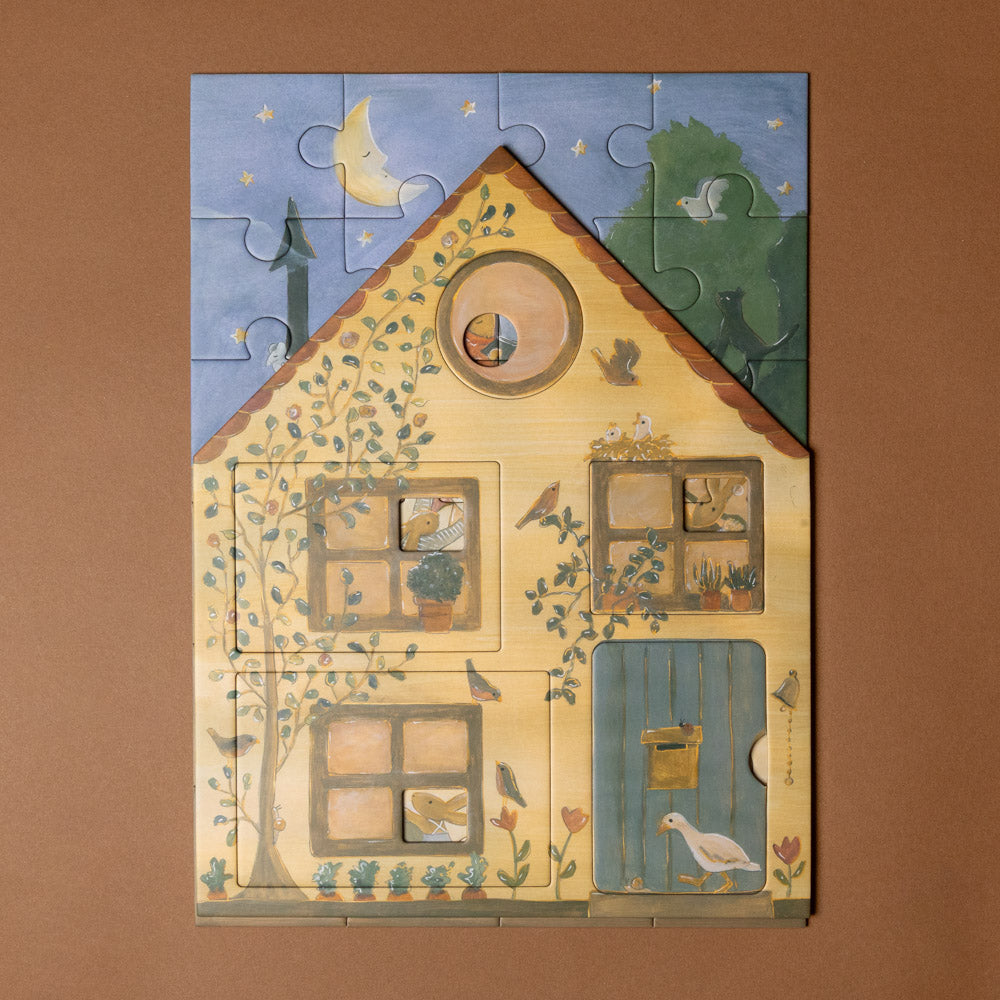 rabbit-family-house-puzzle Children's puzzle with a house design on a brown background