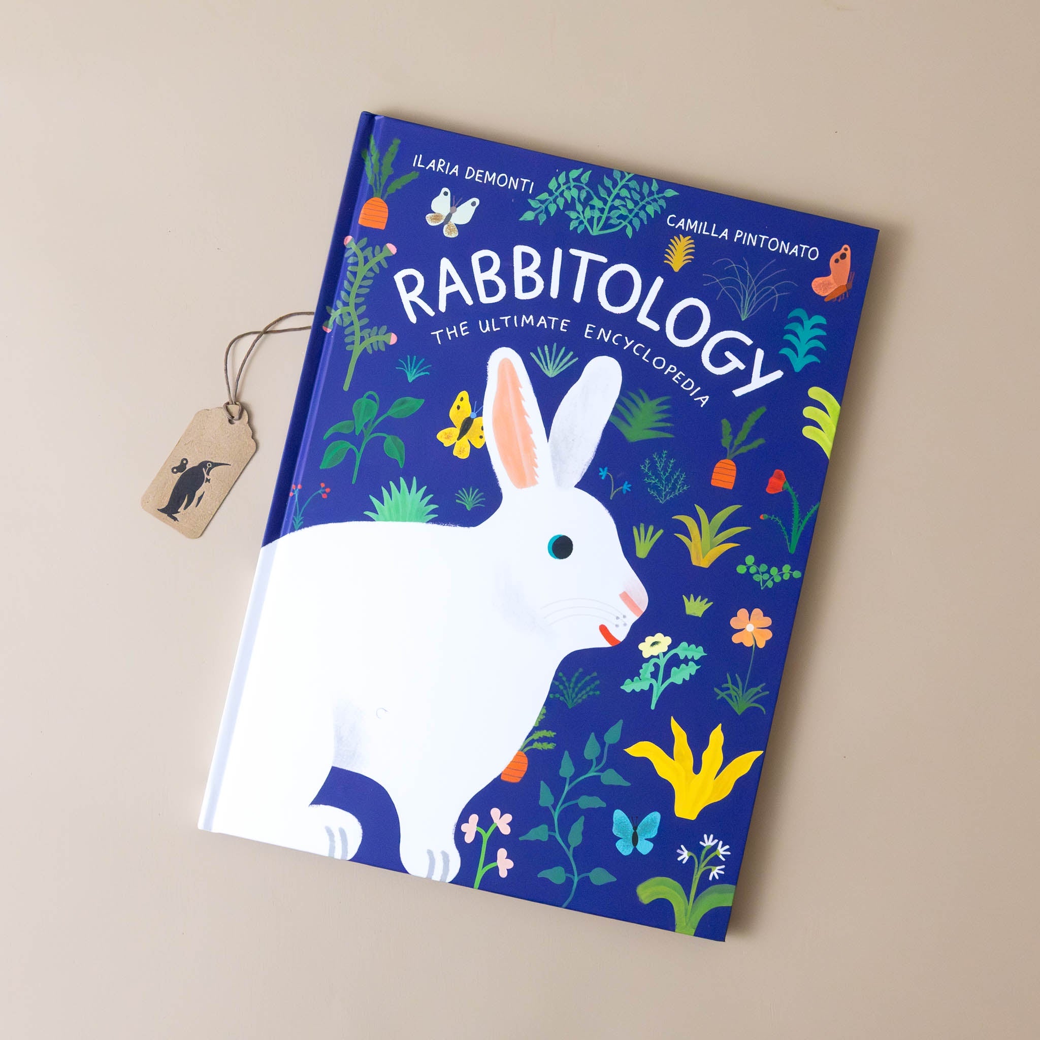 rabbitology-the-ultimate-encyclopedia-blue-cover-with-white-rabbits-and-flowers