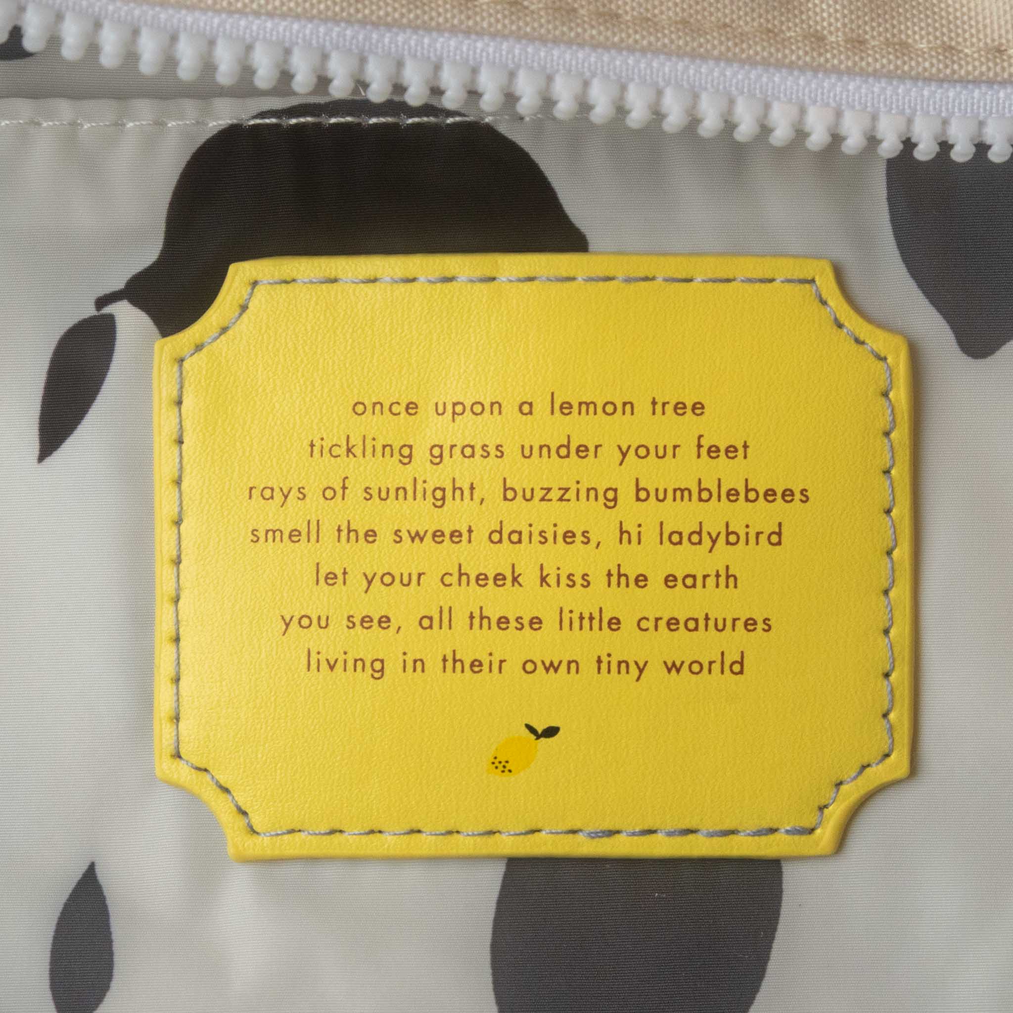 Yellow fabric patch with a poem and lemon illustration on a white background