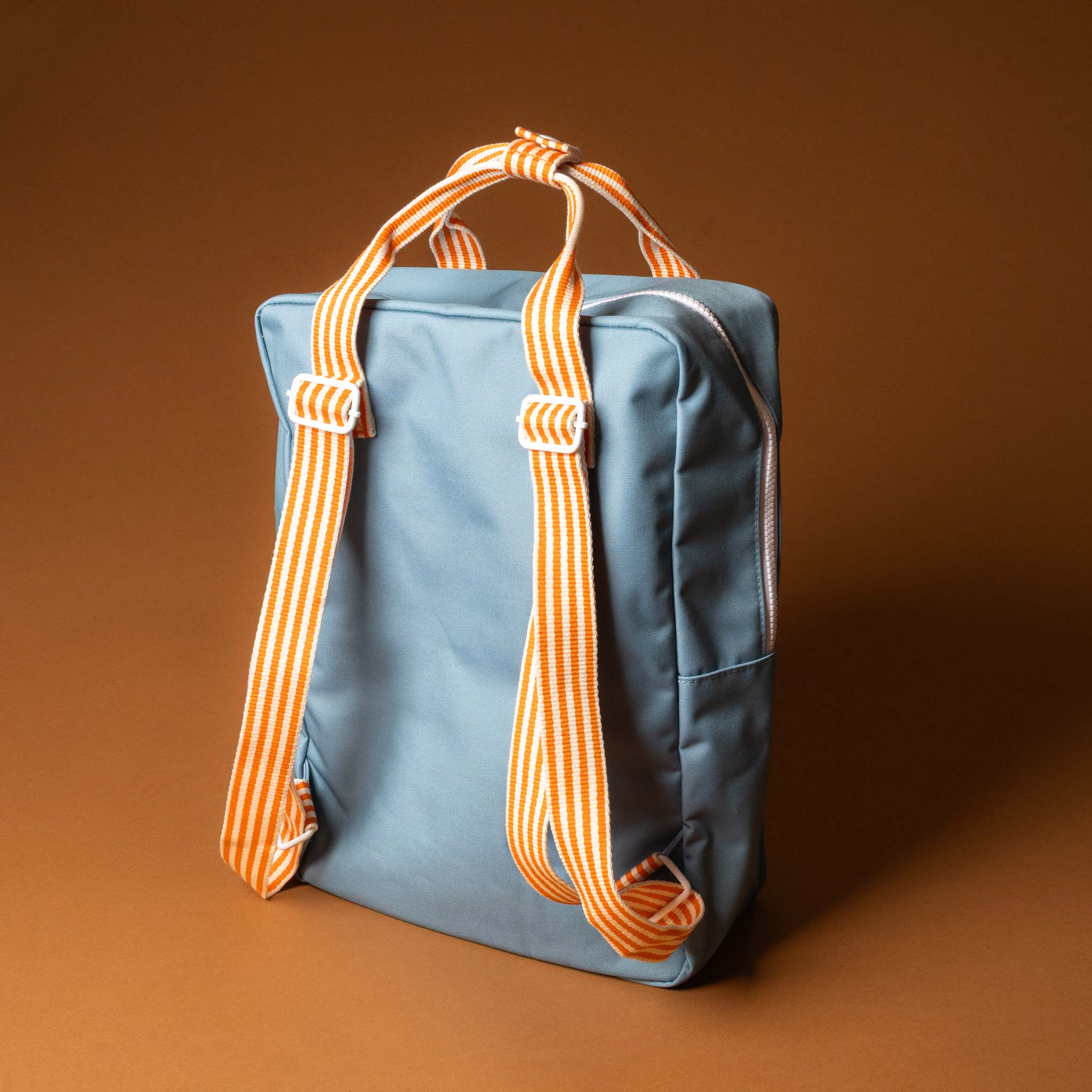 recycled-wonders-envelope-backpack-large-aquamarine-Blue-backpack-with-yellow-lightblue-accents-and-orange-striped-straps