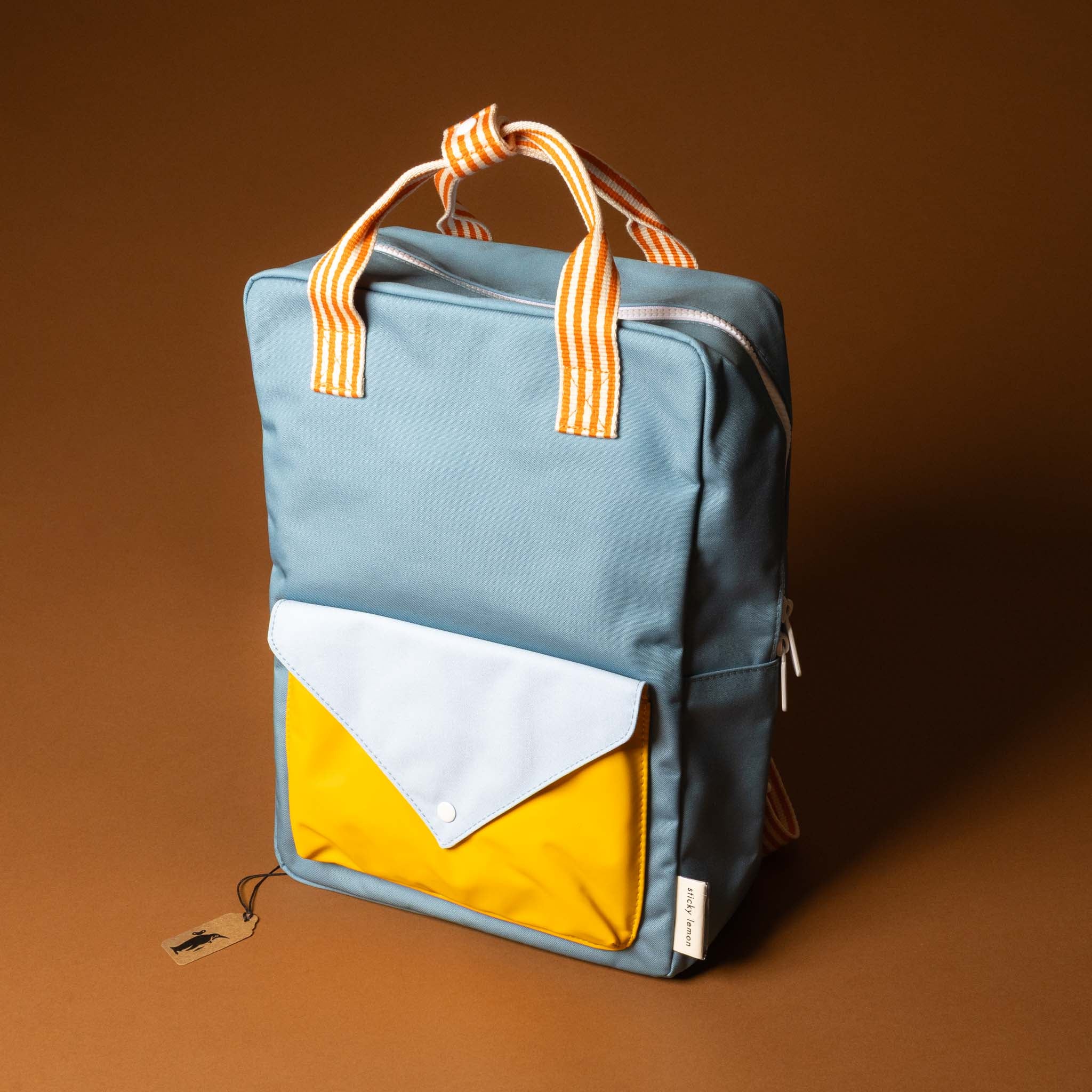 recycled-wonders-envelope-backpack-large-aquamarine-Blue-backpack-with-yellow -lightblue-accents-and-orange-striped-straps