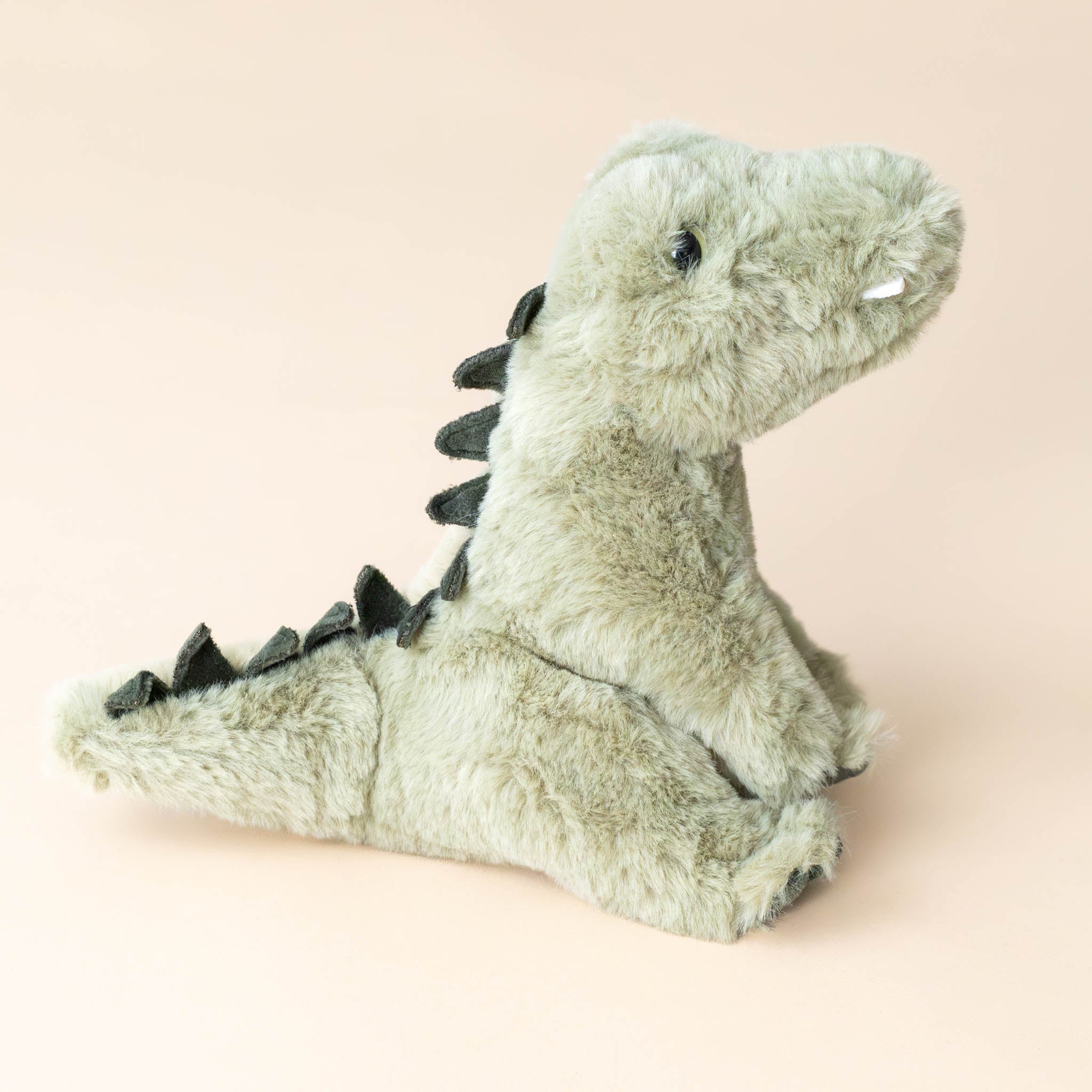 rex-the-alligator-sitting---small-with-jagged-scales-and-teeth-side