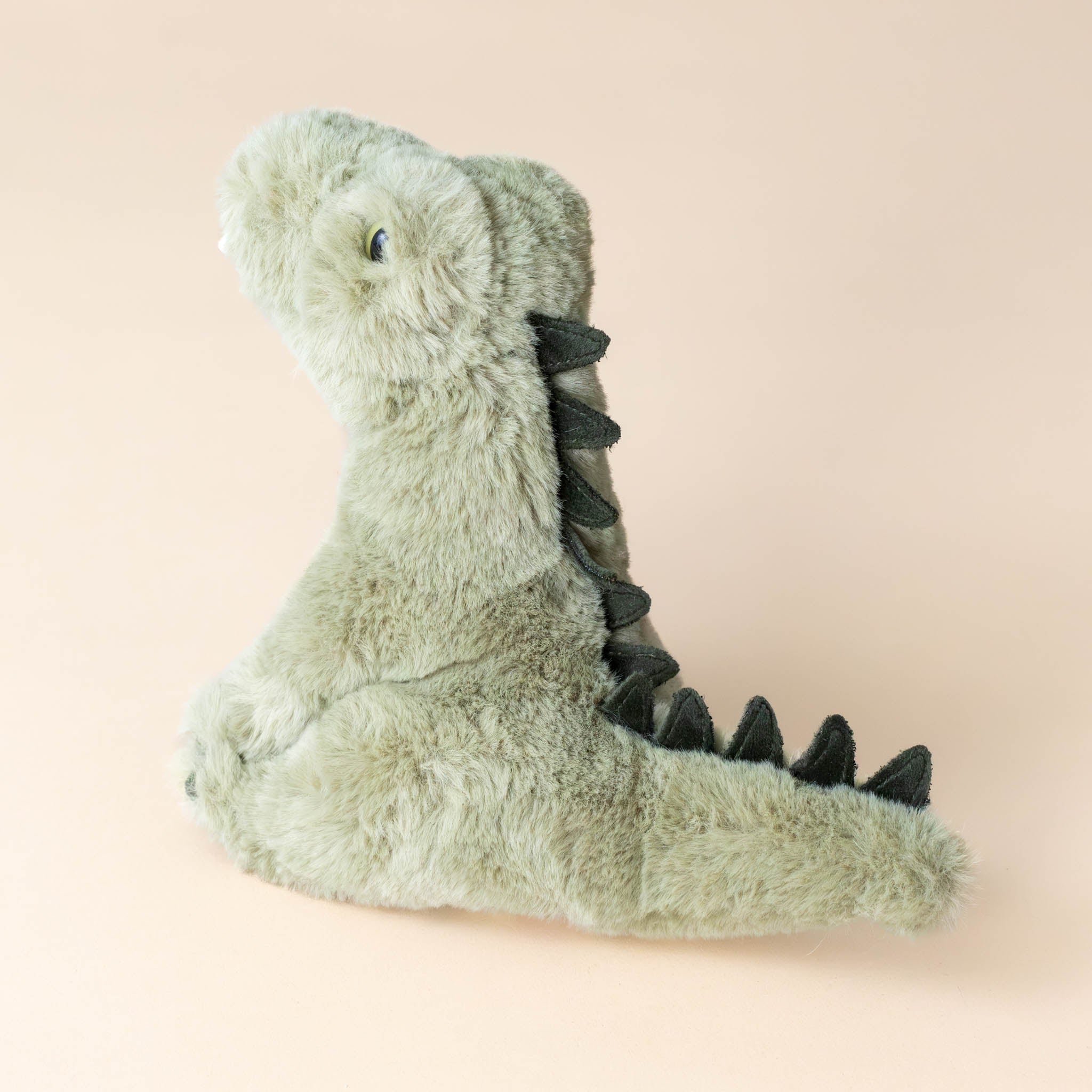 rex-the-alligator-sitting---small-with-jagged-scales-and-teeth-side
