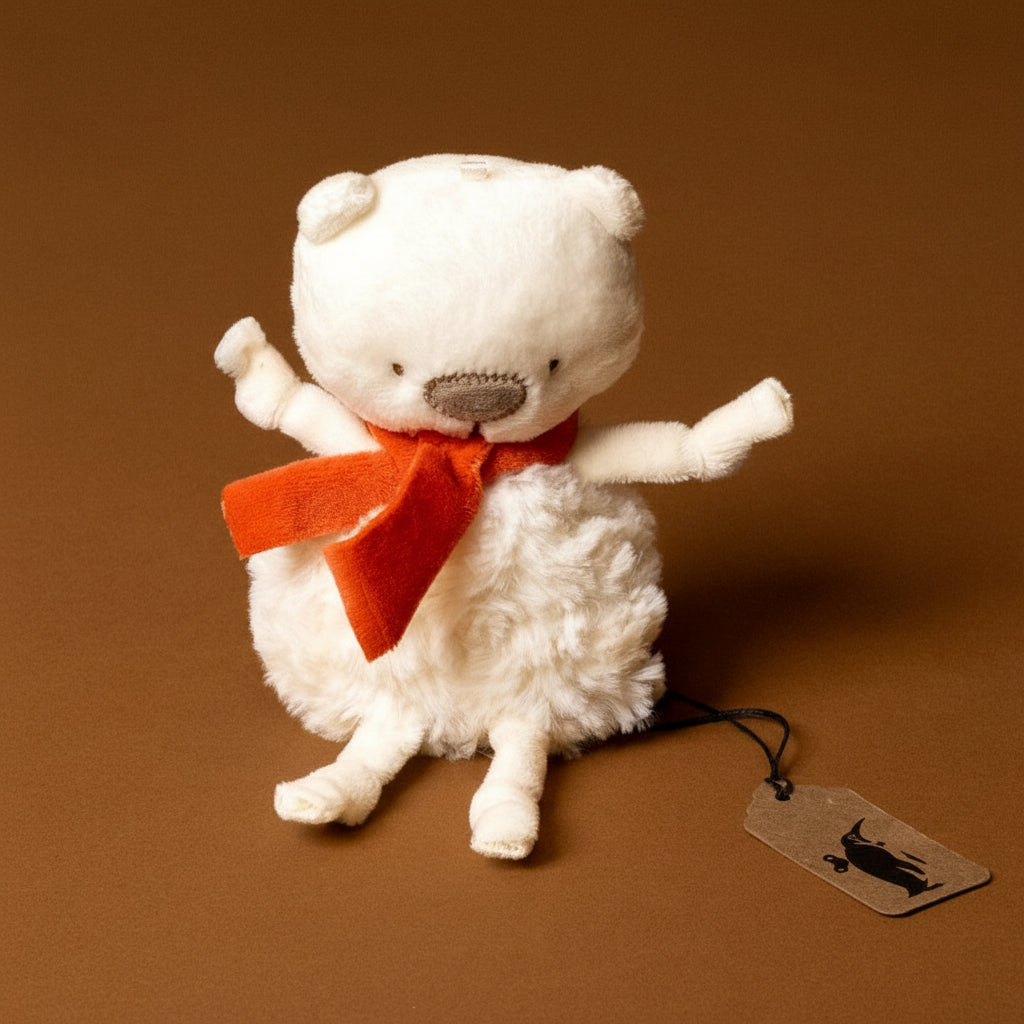 White troly-poly-polar-bear-bo with a red bow tie on a brown background