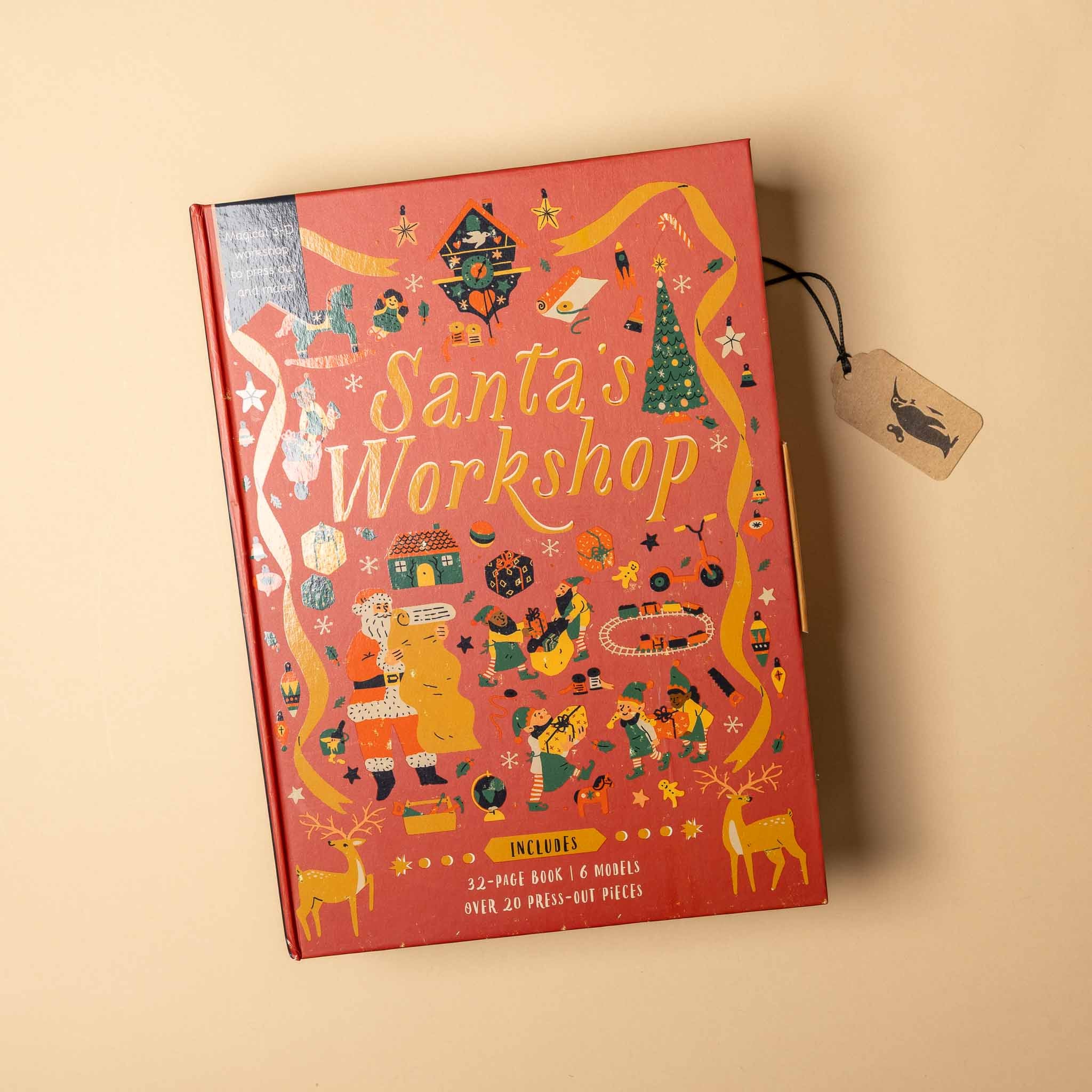 Red box with 'Santa's Workshop' design on a beige background