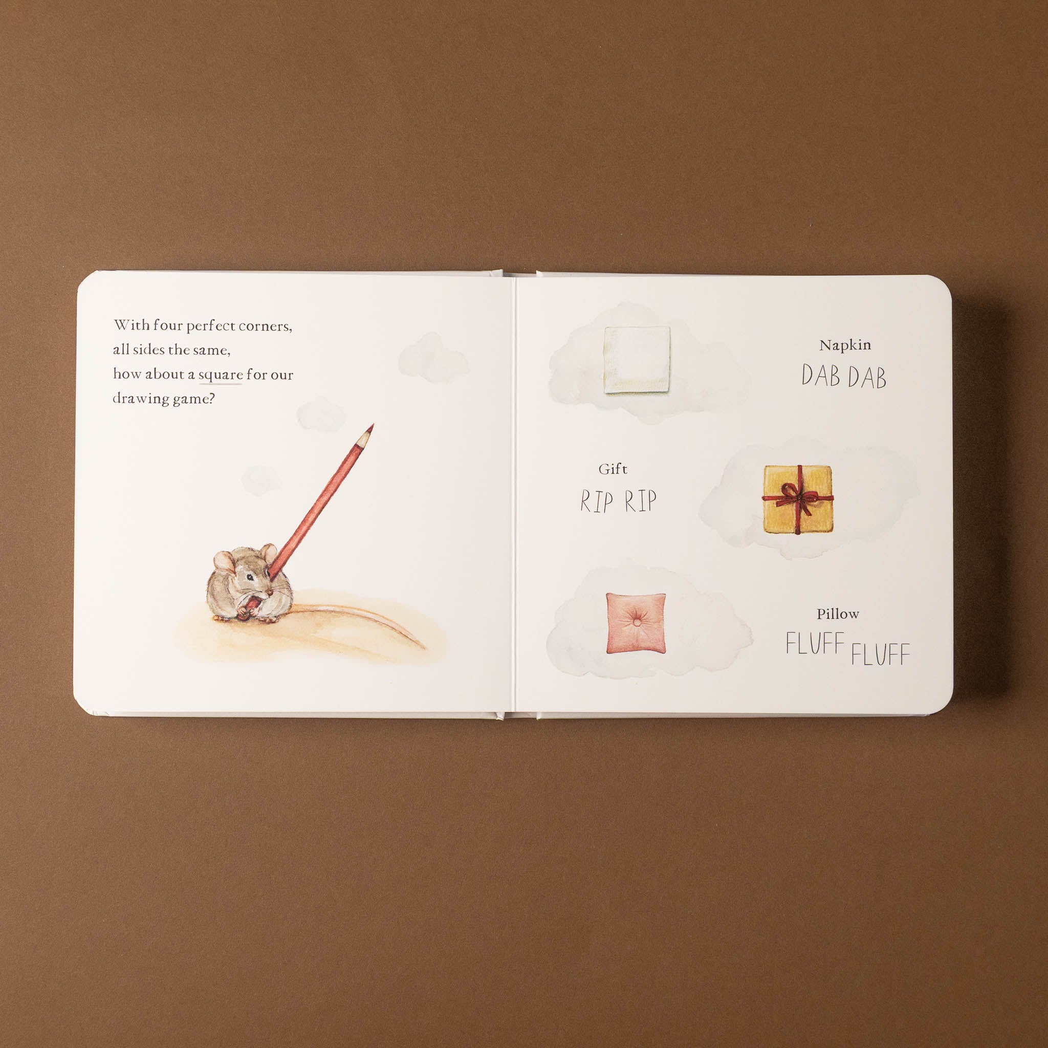 Open scribble-scrabble-a-first-words-and-shapes-board-book with illustrations and text on a brown background