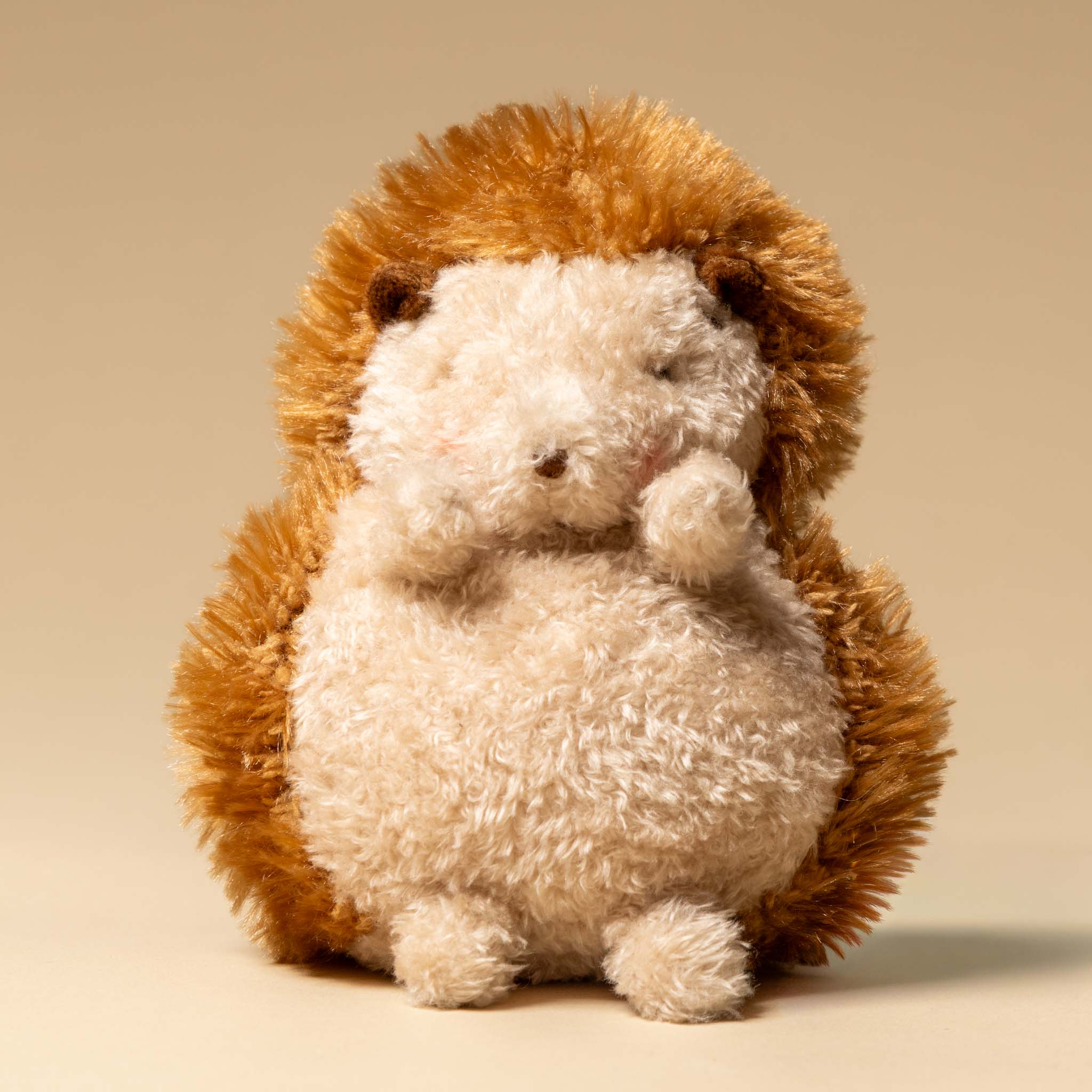 smidgen-the-hedgehog Plush toy hedgehog on a beige background