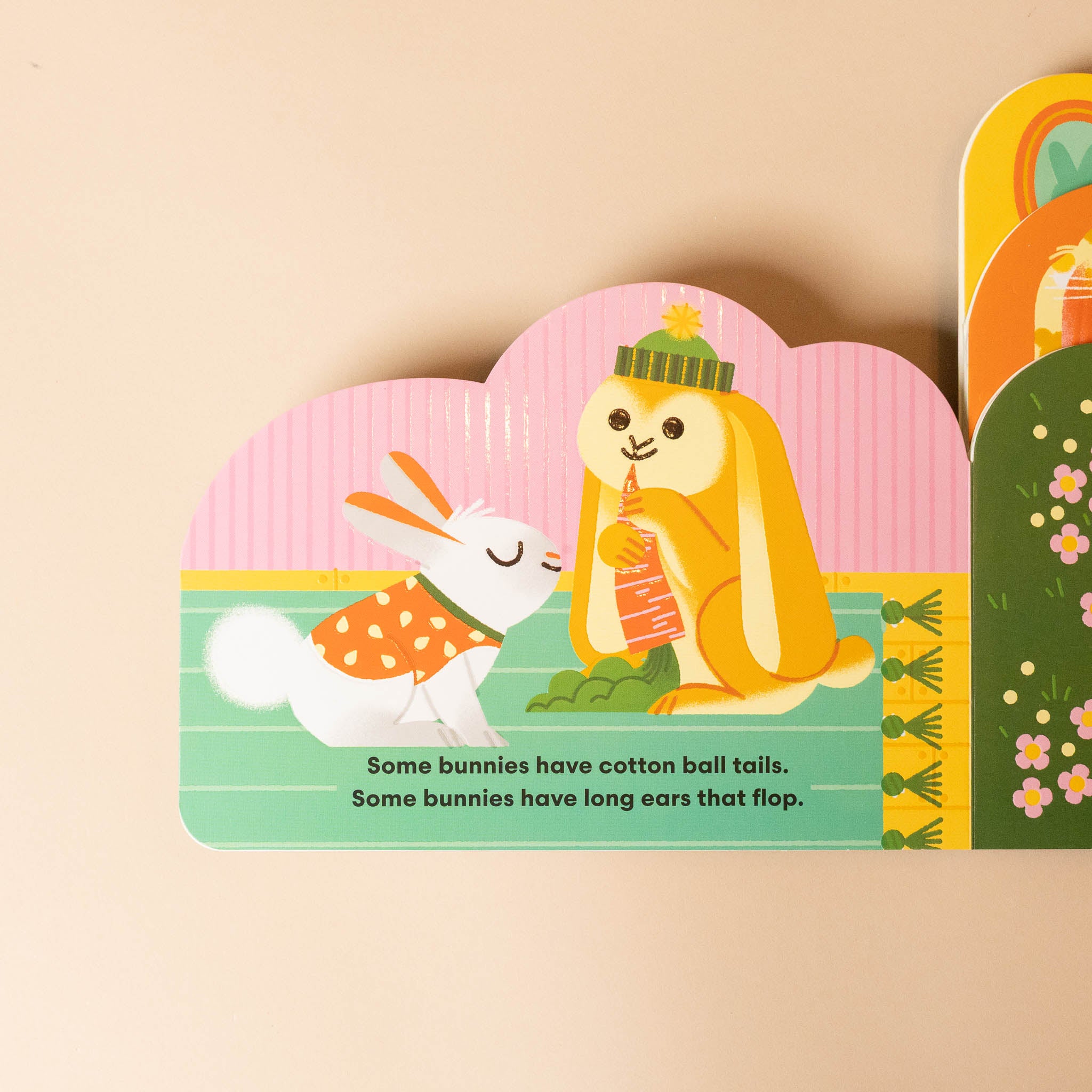 some-bunnies-board-book Children's book page with cartoon characters and text on a beige background