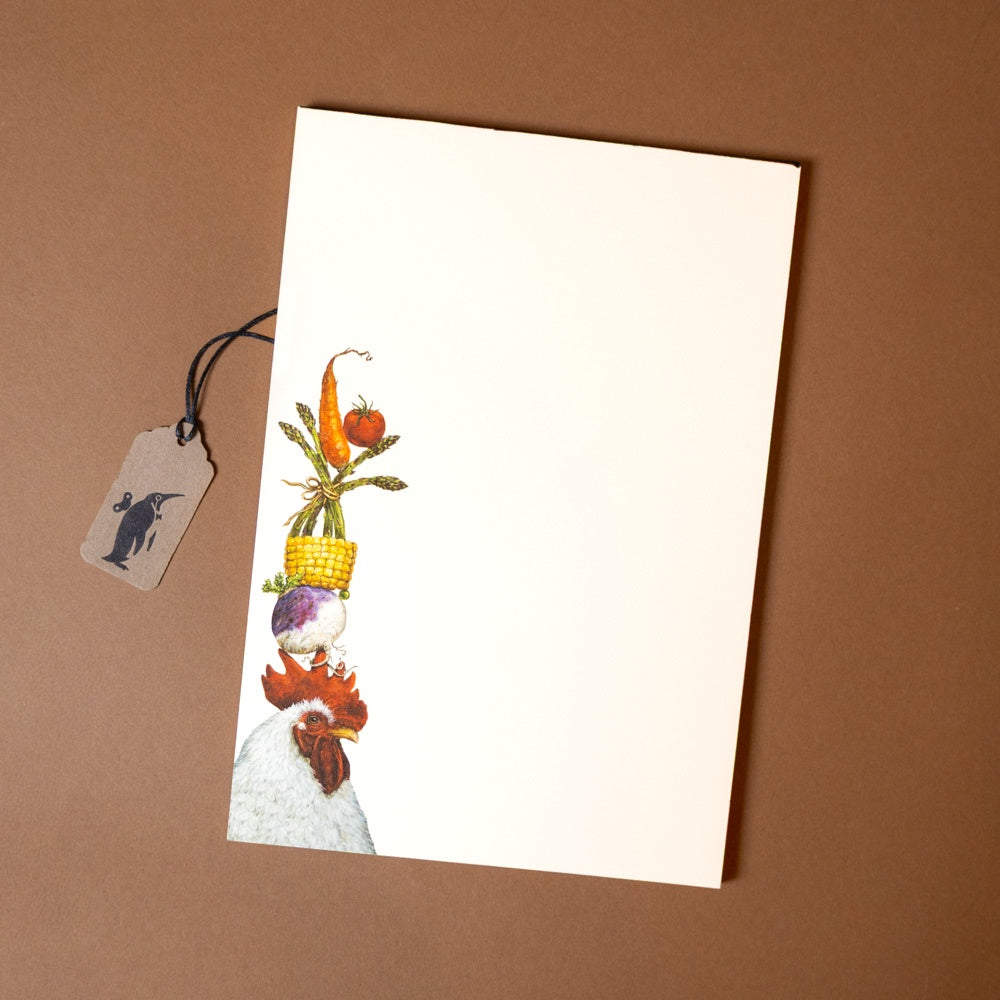 steady-rooster-notepad Notebook with a chicken and vegetables illustration on a brown background
