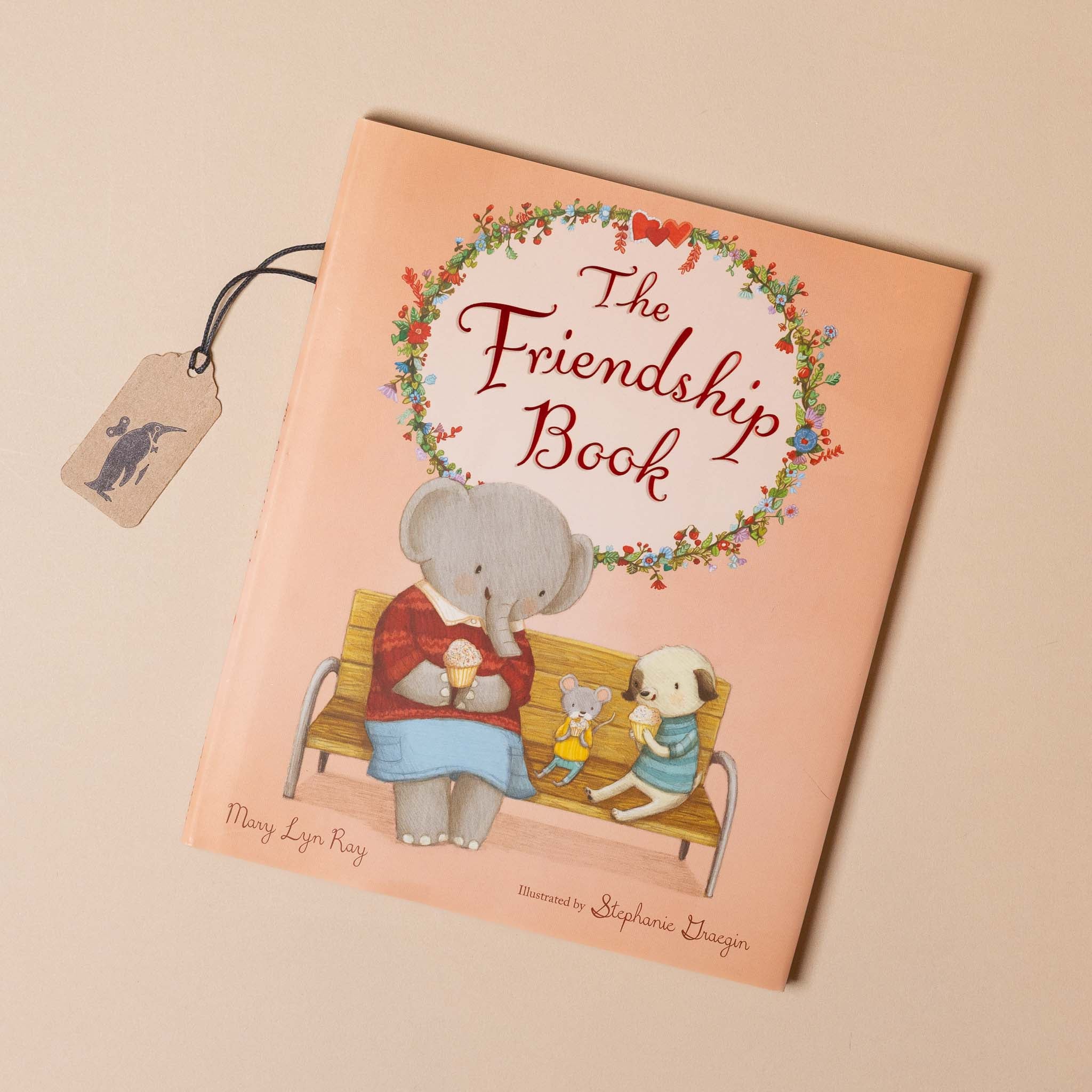 Book titled 'The Friendship Book' with illustrations of an elephant and a dog on a bench.