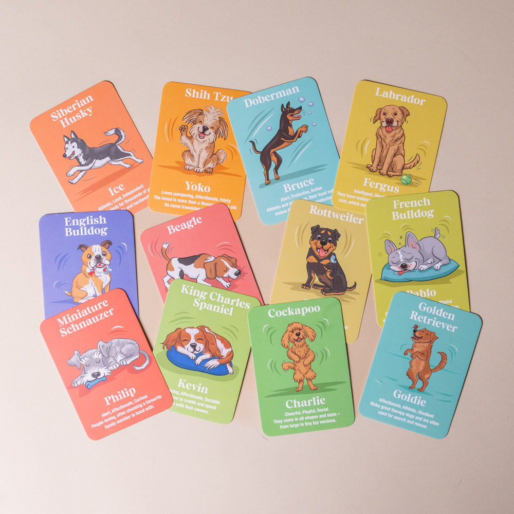 the-greatest-show-dog-family-card-game Set of cards featuring illustrations of various dog breeds on a beige background