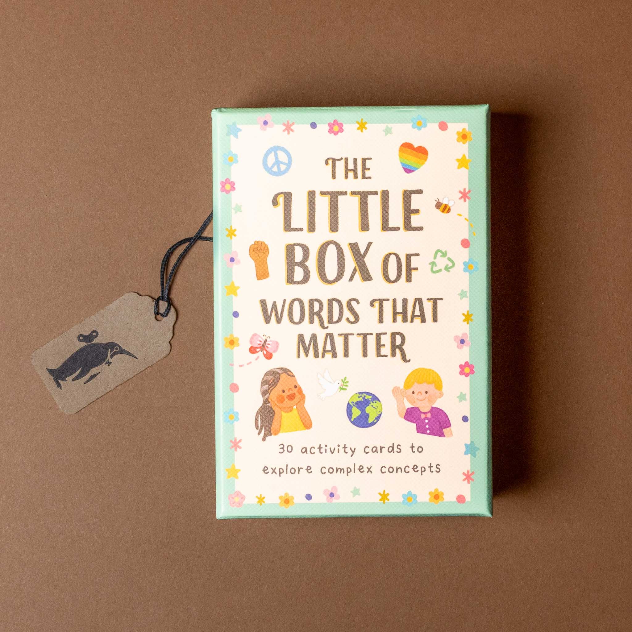 Box of 'The Little Box of Words That Matter' activity cards on a brown background