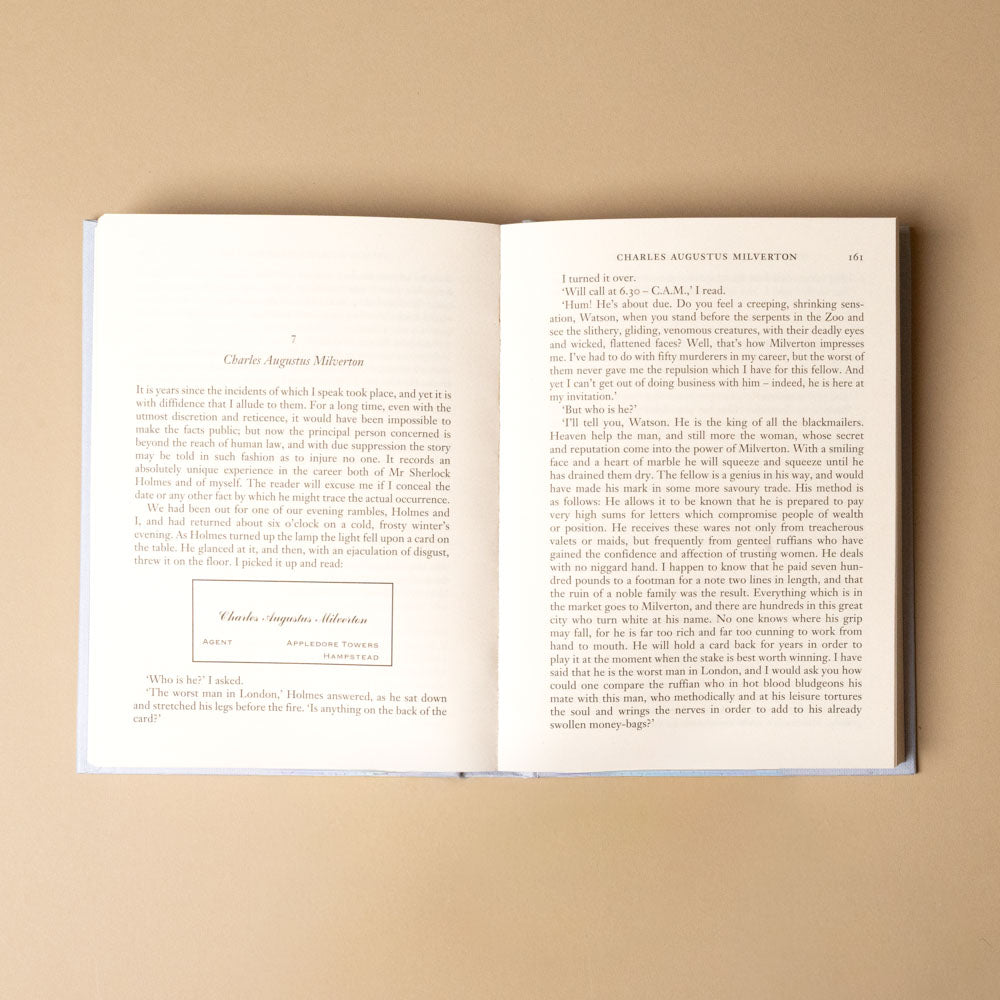 the-return-of-sherlock-holmes Open book with text on a beige background