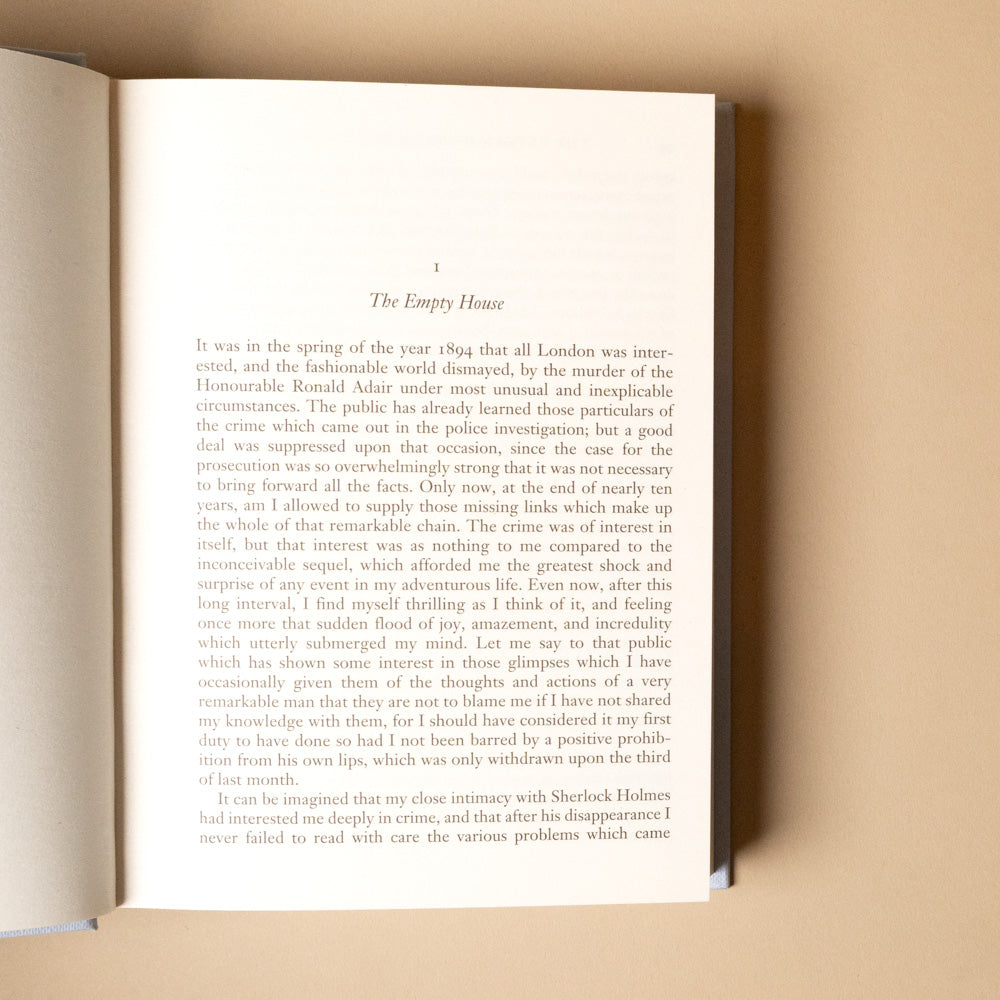 the-return-of-sherlock-holmes Open book with text on a beige background