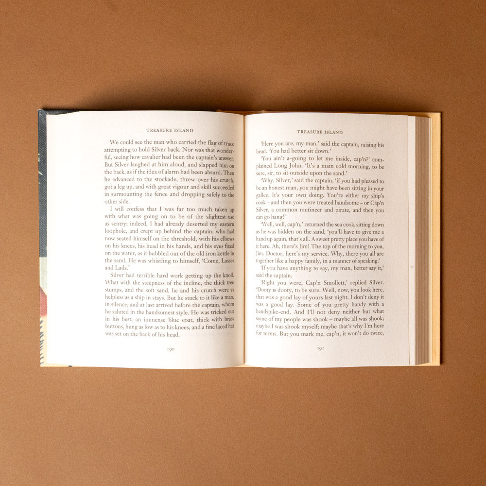 treasure-island- Open book on a brown background