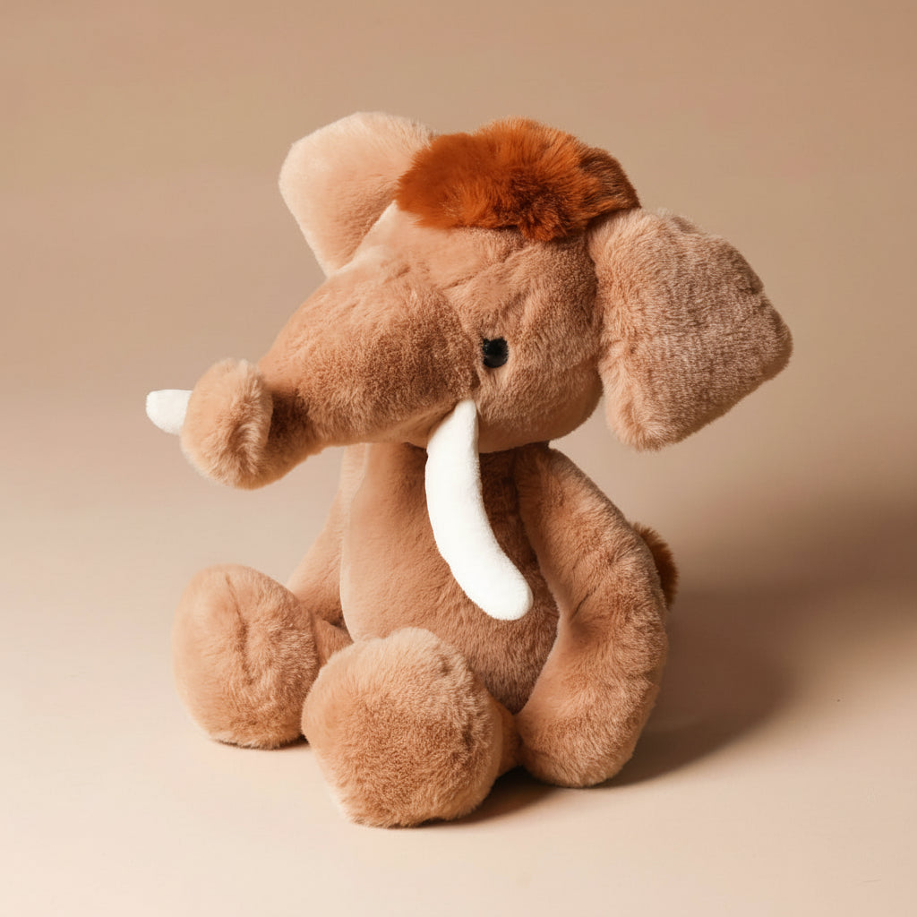 Plush wally-the-mammoth toy on a beige background