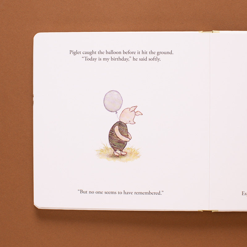 winnie-the-pooh-finding-feelings-board book open page with piglet holding a balloon