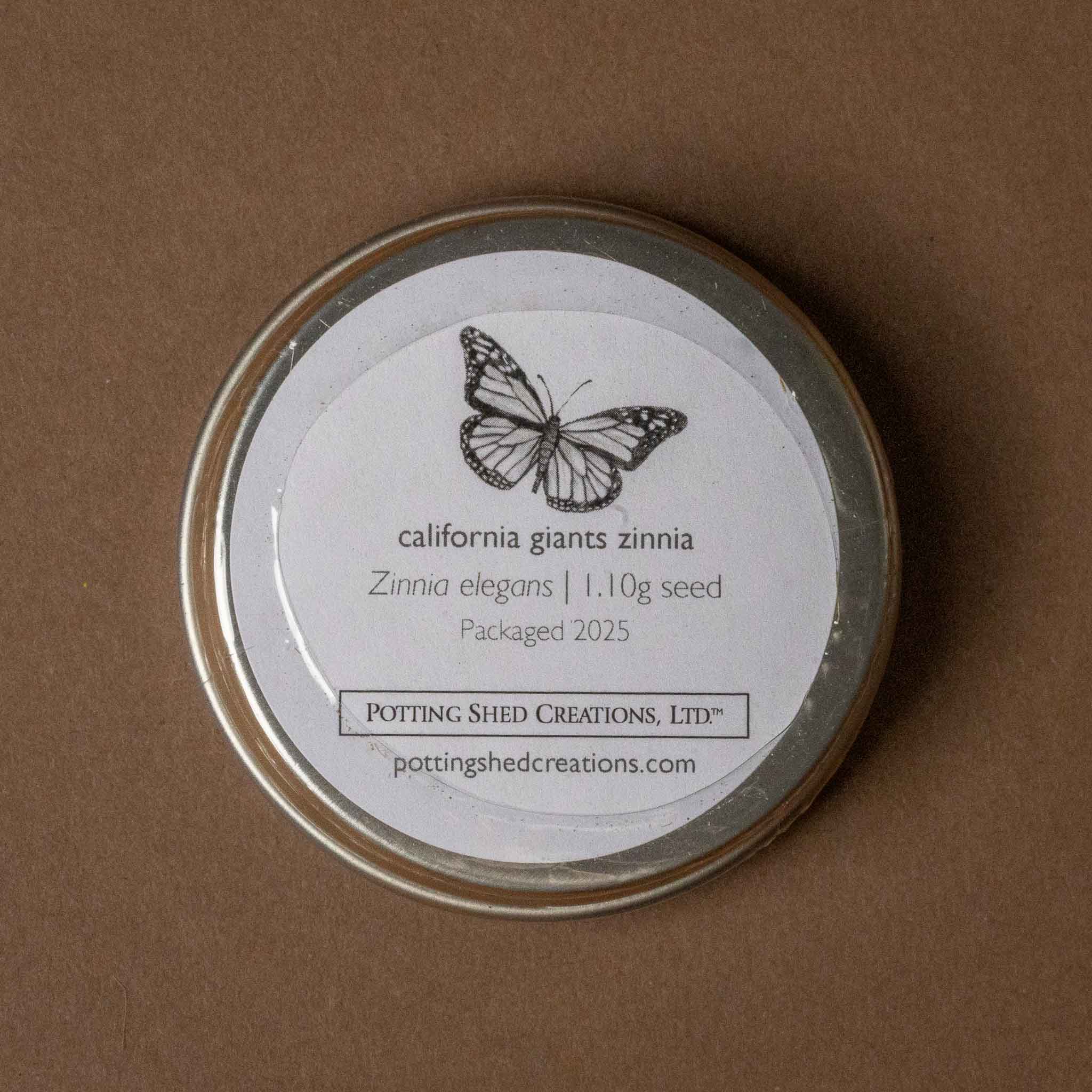 wooden-garden-box-mixed-zinnias Seed container with butterfly design and text on a brown background