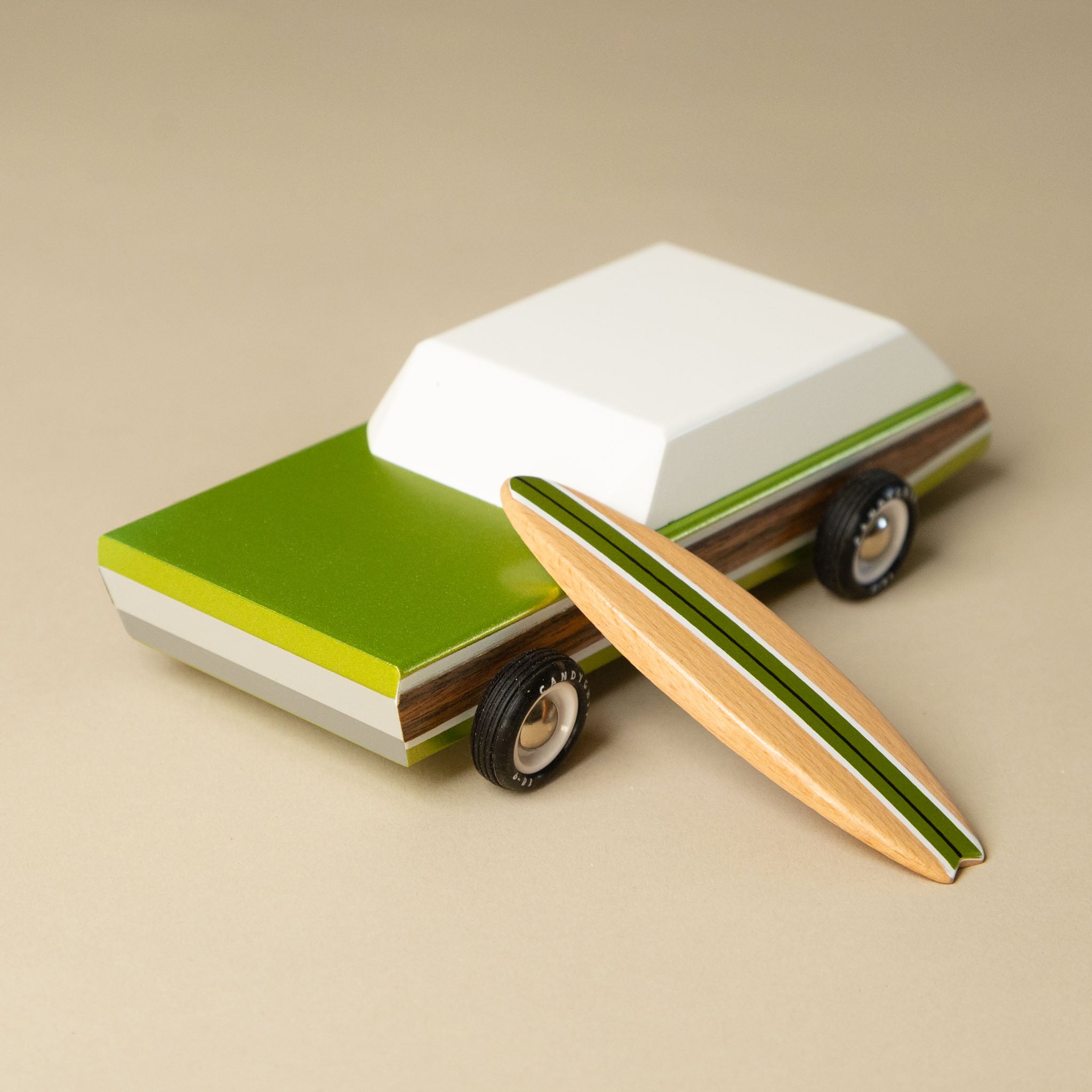 wooden-surf-wagon with a surfboard on a beige background