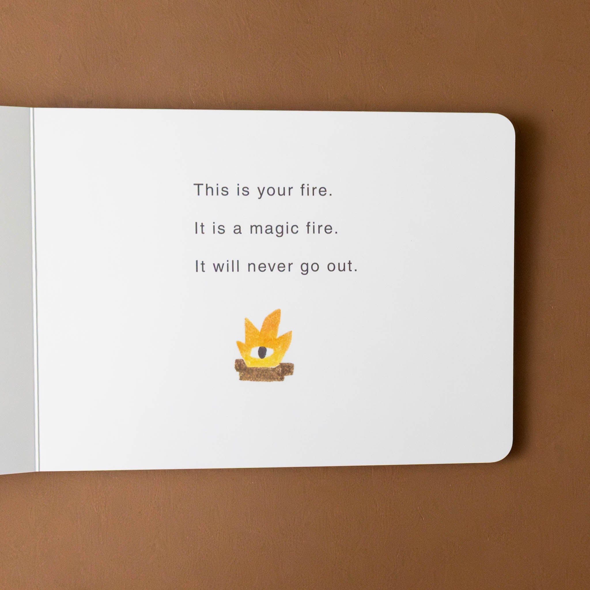 your-island-board-book-interior-page-with-fire-text-this-is-your-fire-it-is-a-magic-fire-it-will-never-go-out