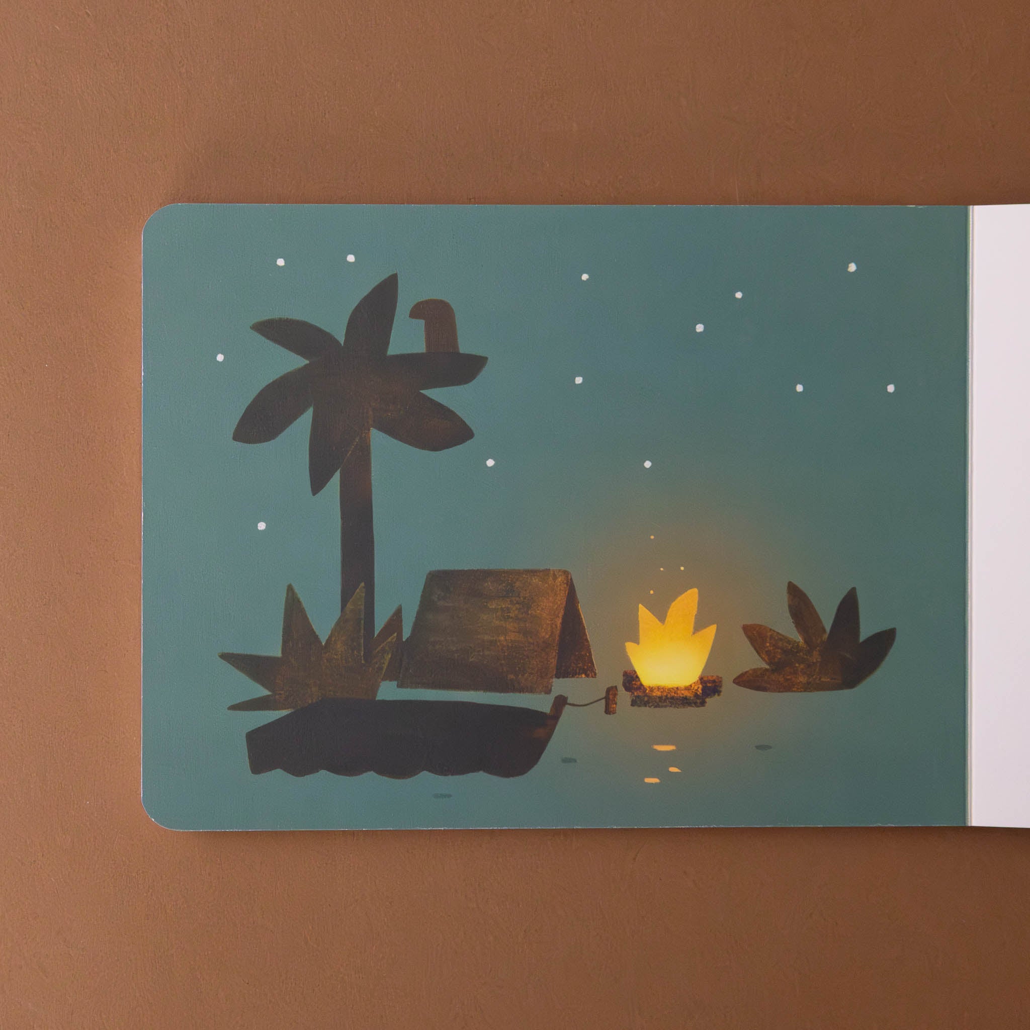 your-island-board-book-interior-page-with-a-nightime-scene-of-fire-tent-boat-palm-and-bush