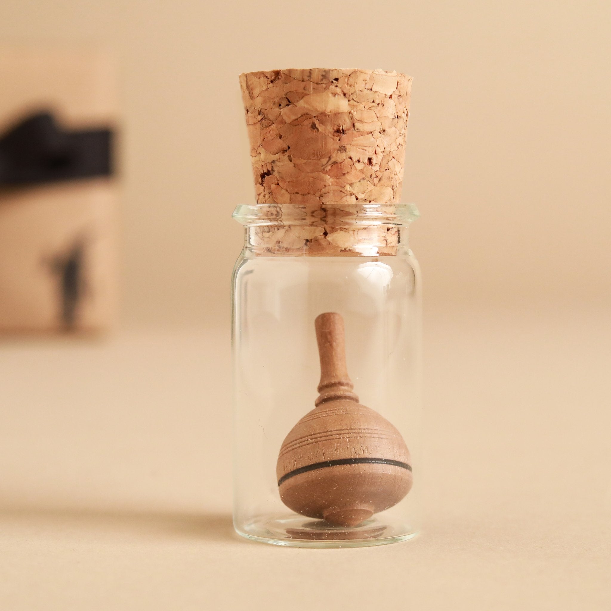 dark-wood-top-within-glass-jar