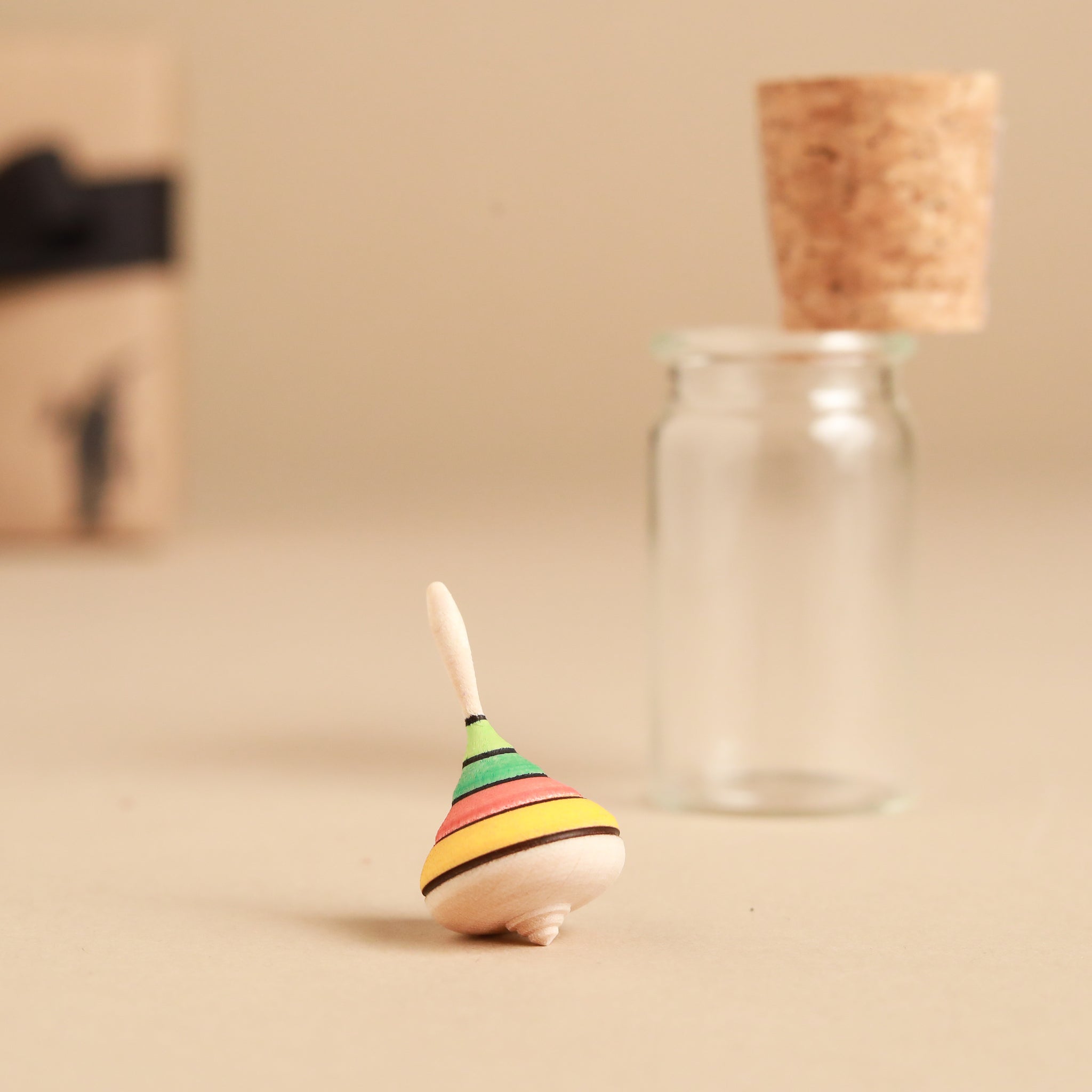 warm-color-striped-top-outside-of-glass-jar