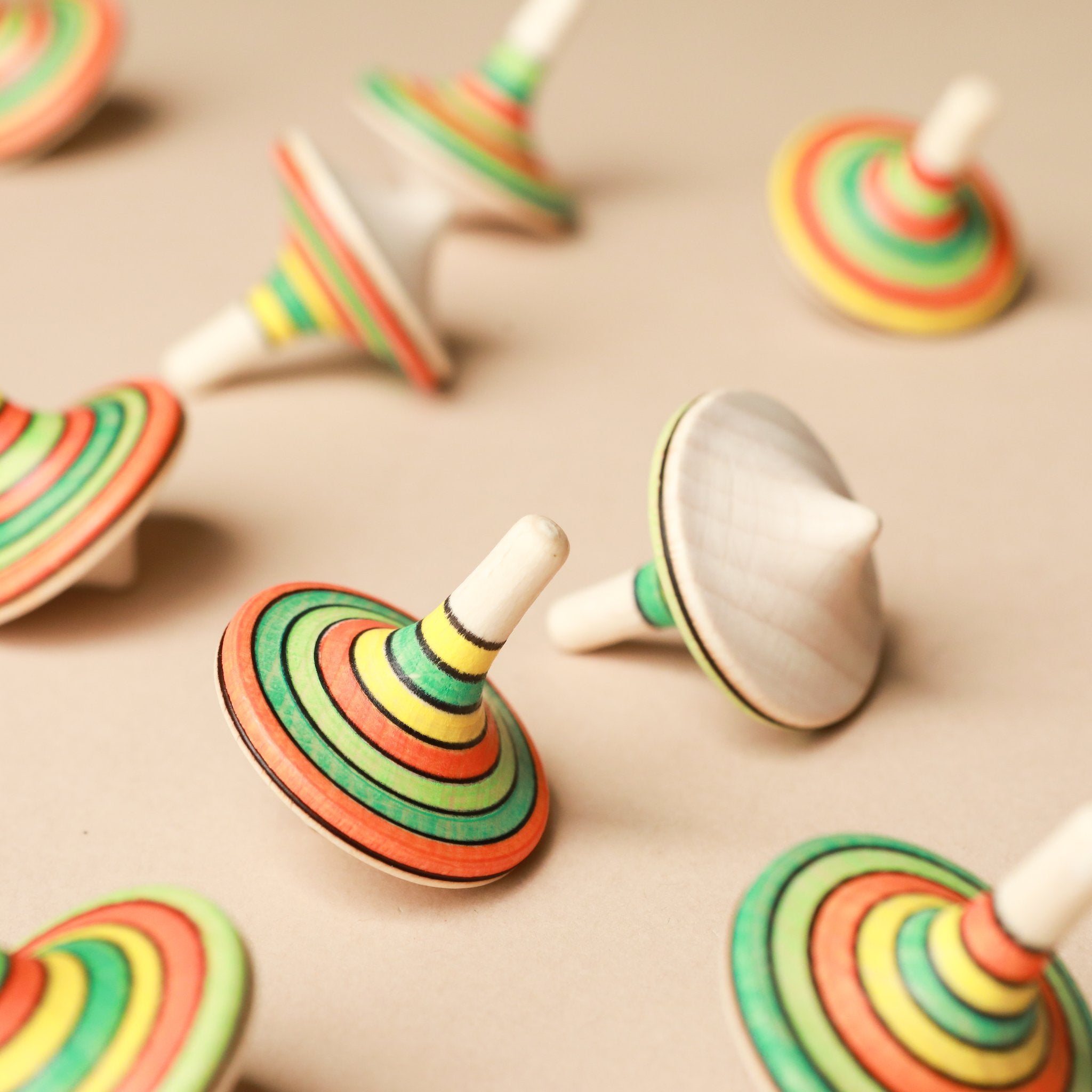many-spinning-tops-scattered