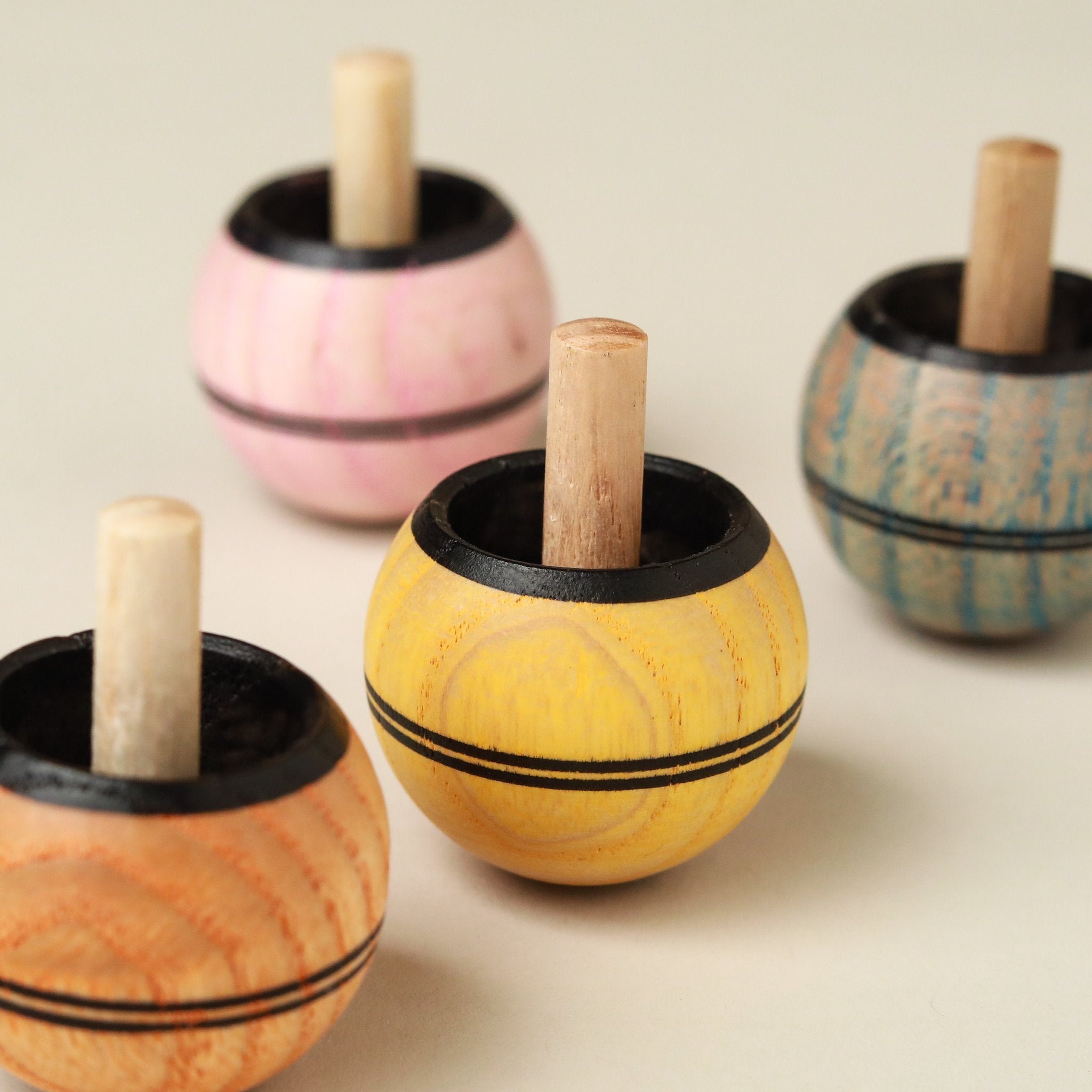 group-of-light-color-washed-spinning-tops