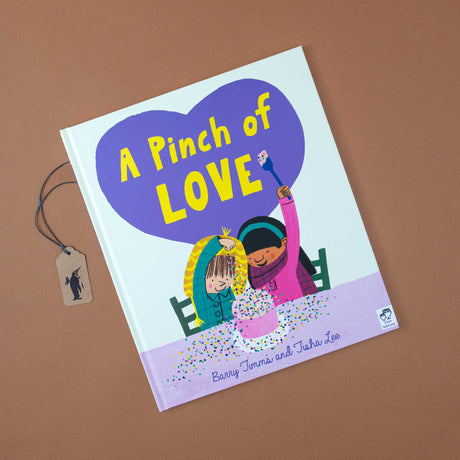 front-cover-pinch-of-love-two-children-decorating-a-cake