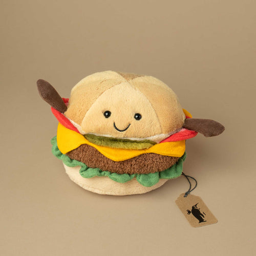 small-burger-bun-with-cheese-tomato-pickle-lettuce-and-meat-patty-and-smiley-face