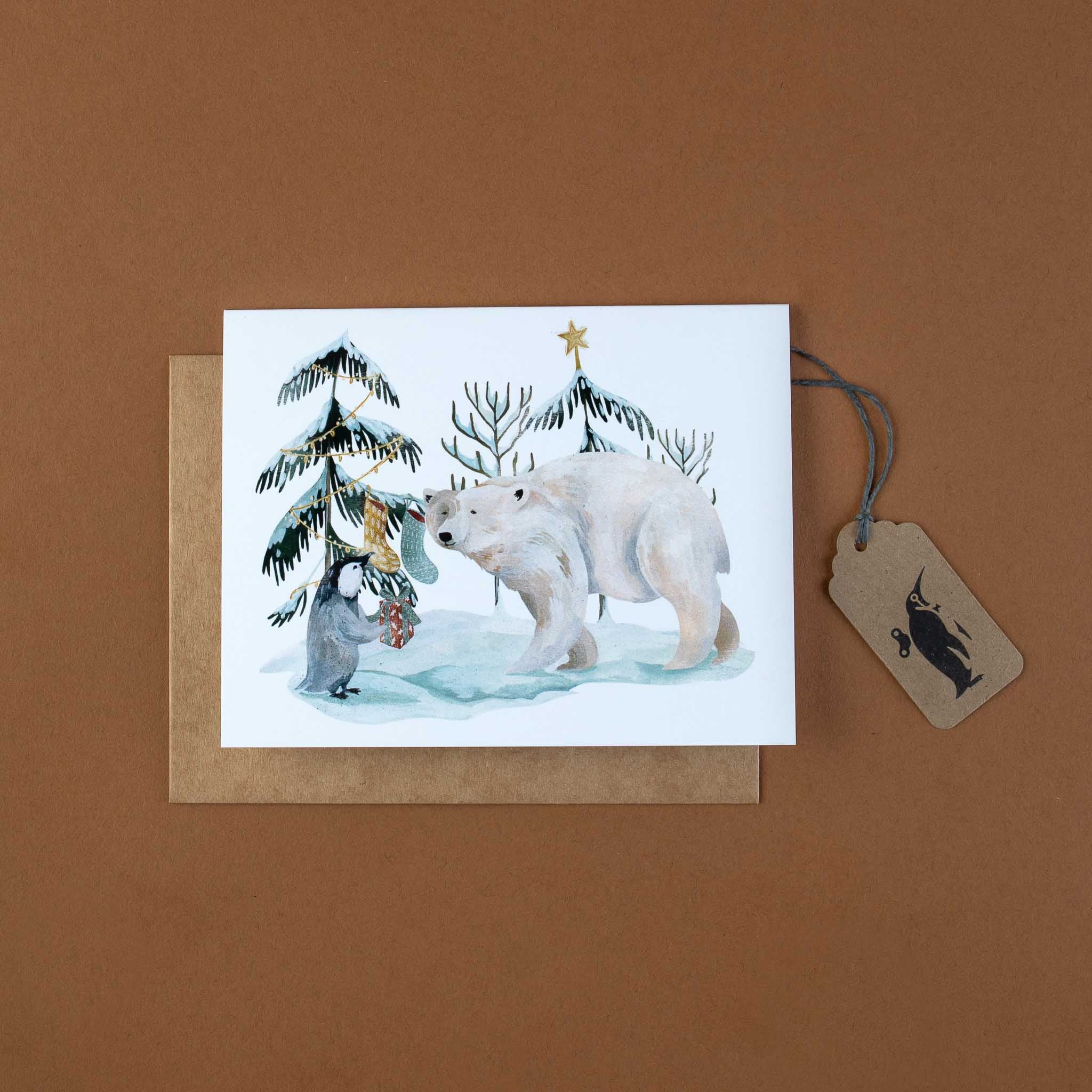 arctic-holiday-greeting-card-with-penguin-and-polar-bear-decorating-trees