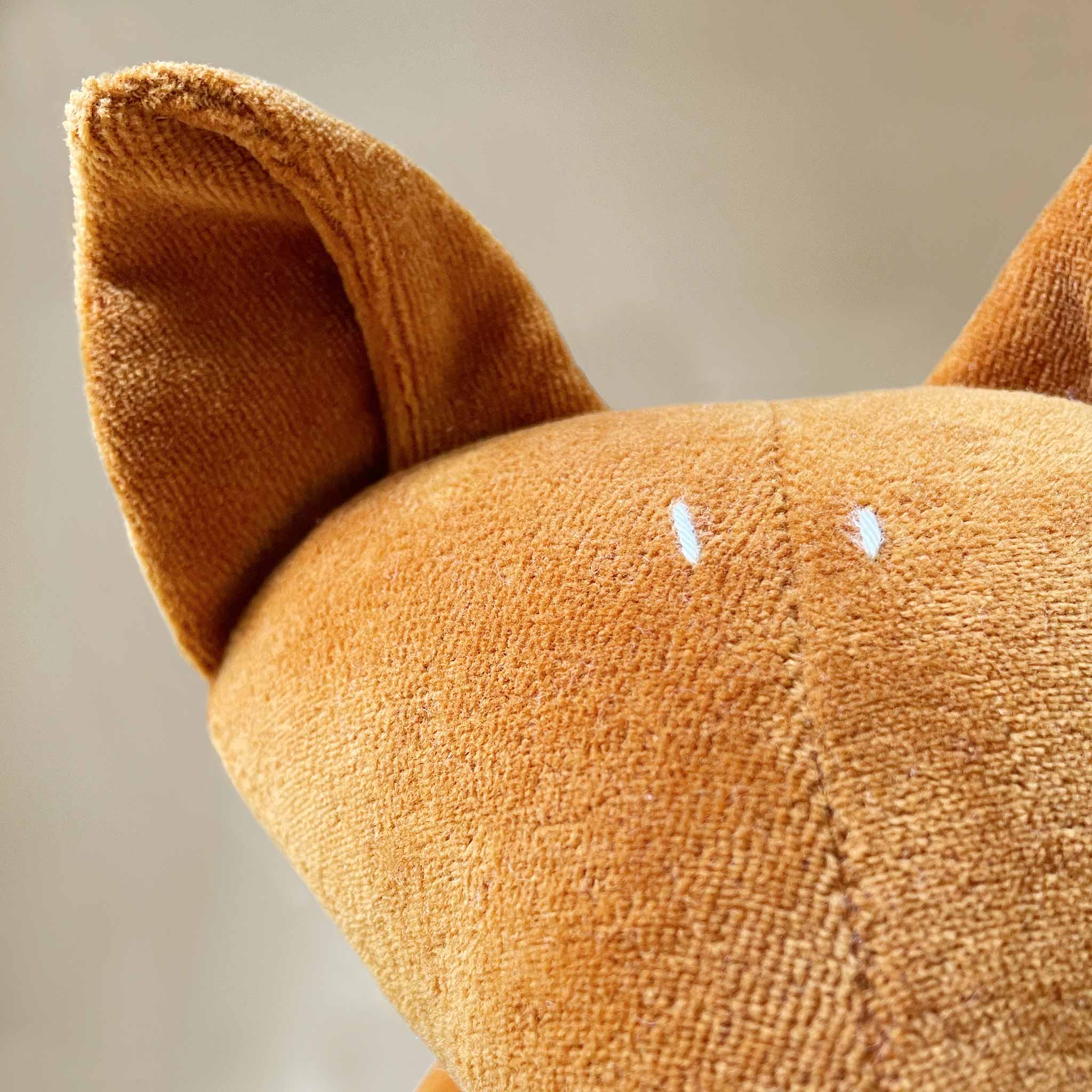 detail-of-stitched-eyes-and-big-ears