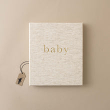 Load image into Gallery viewer, beige-cloth-covered-book-gold-word-baby