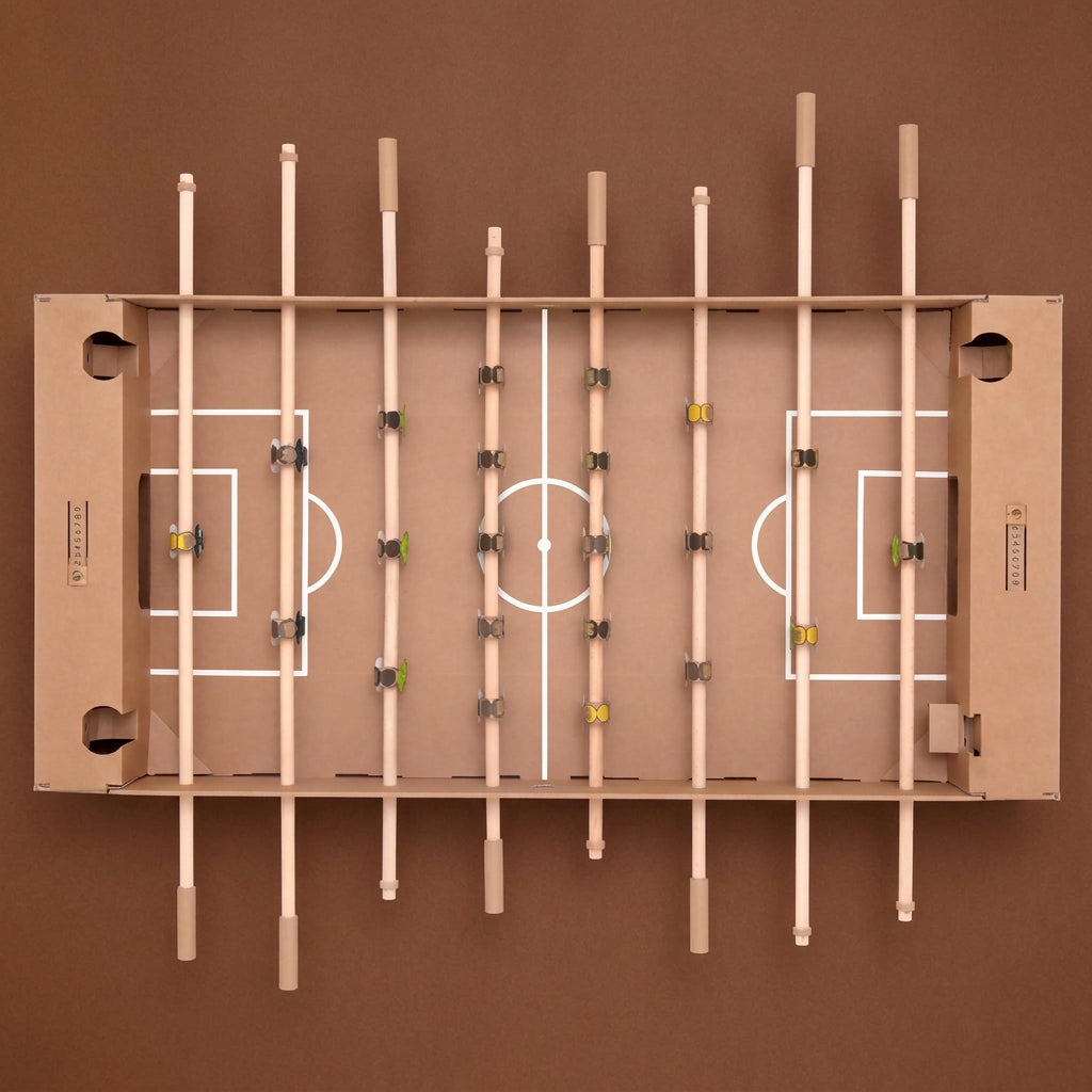 cardboard-foosball-table-overhead-image-of=game-board-with-cardboard-playing-field-with-little-characters-attached-to-each-rod