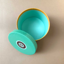 Load image into Gallery viewer, open-round-cardboard-box-from-above-showing-the-mint-colored-inside