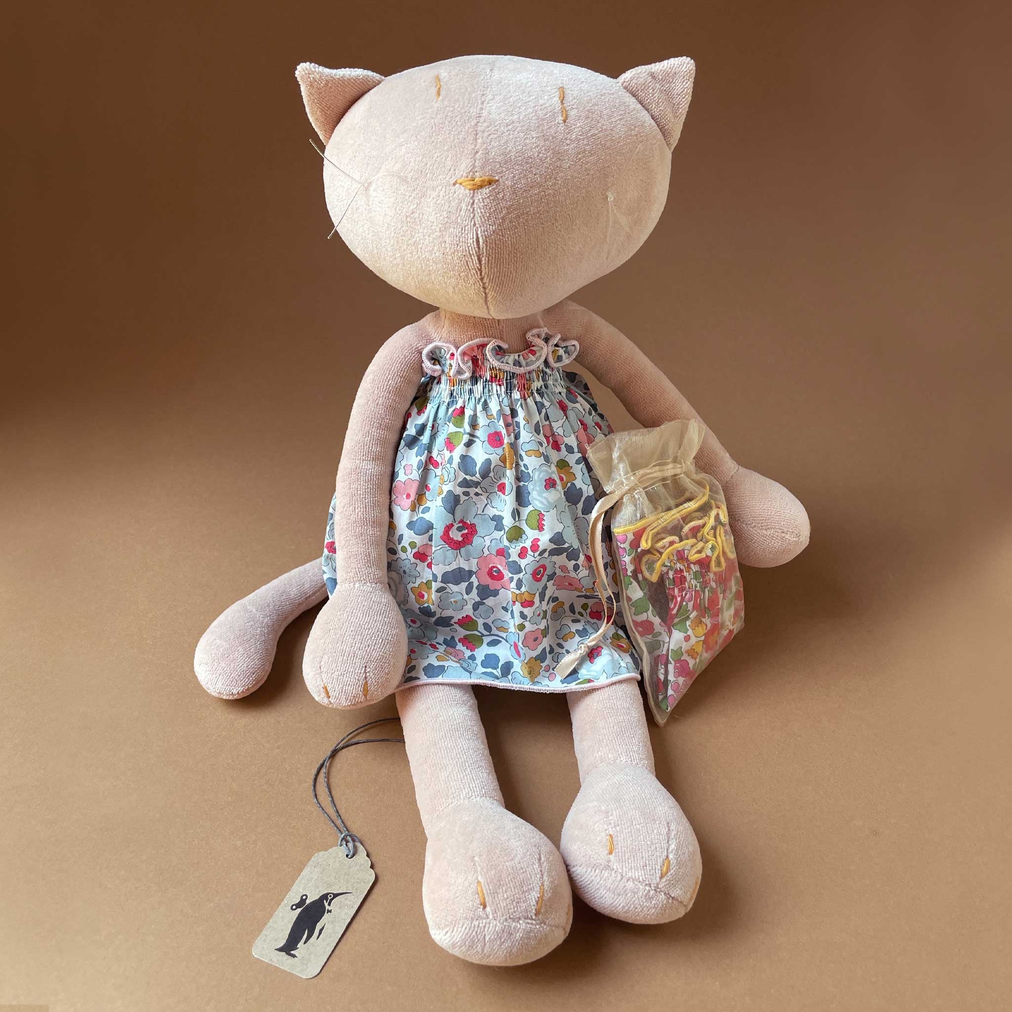 pale-pink-cat-in-blue-and-white-floral-dress