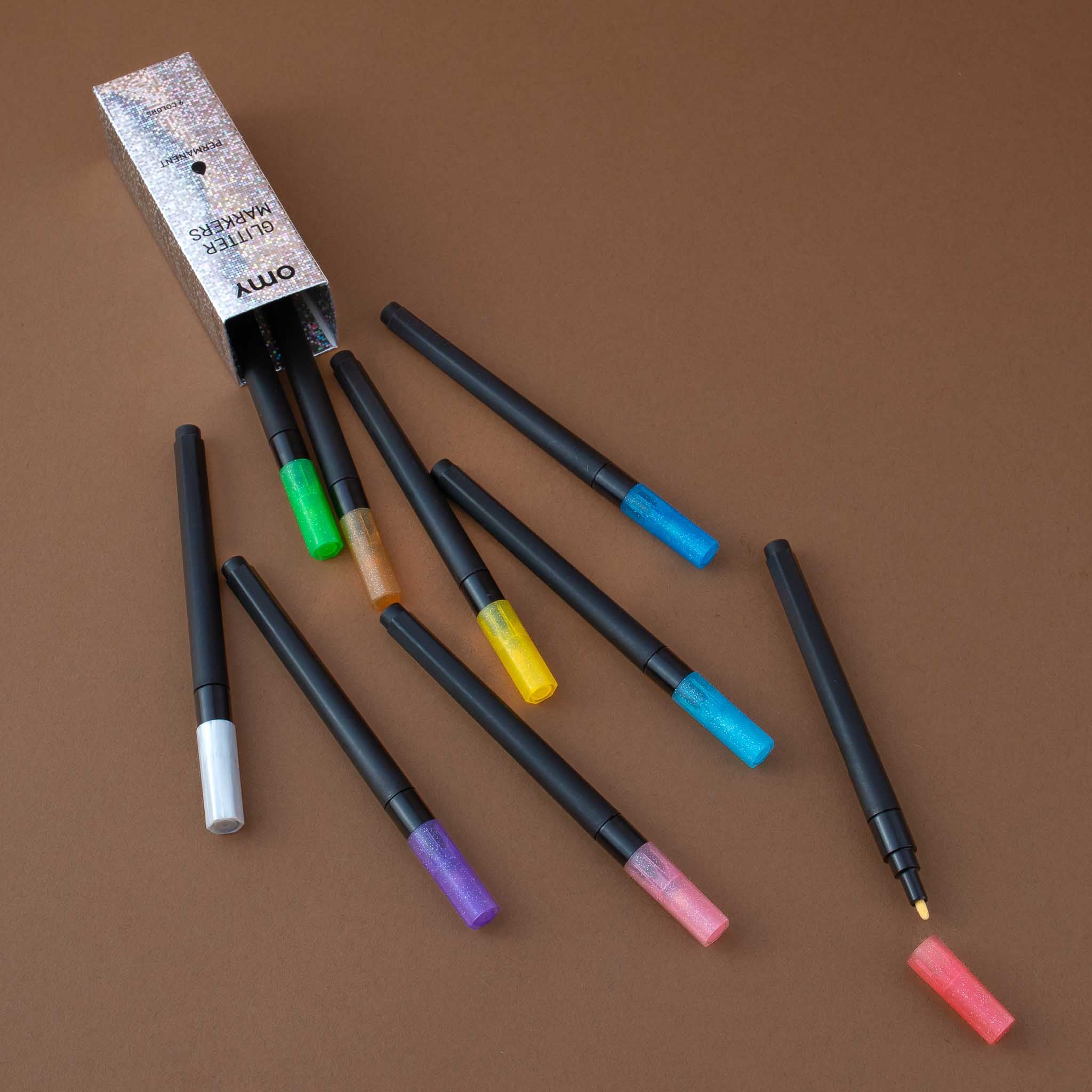 detail-of-glitter-markers-showing-colors-and-open-marker-to-see-the-markers-peak