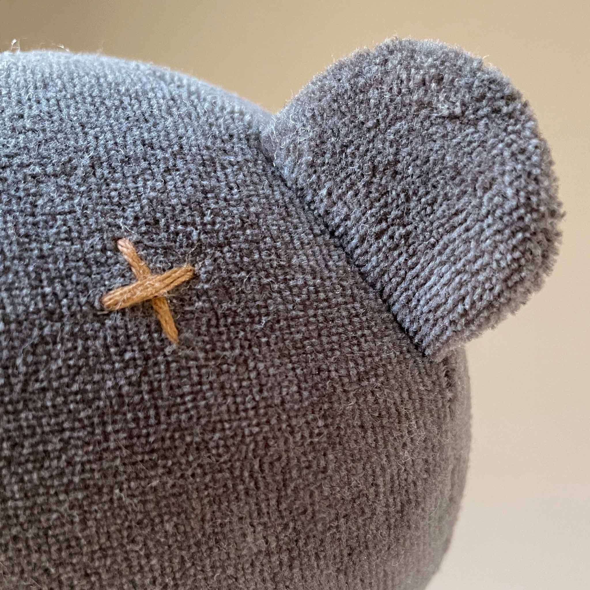 detail-of-stitched-cross-eye-and-little-ear
