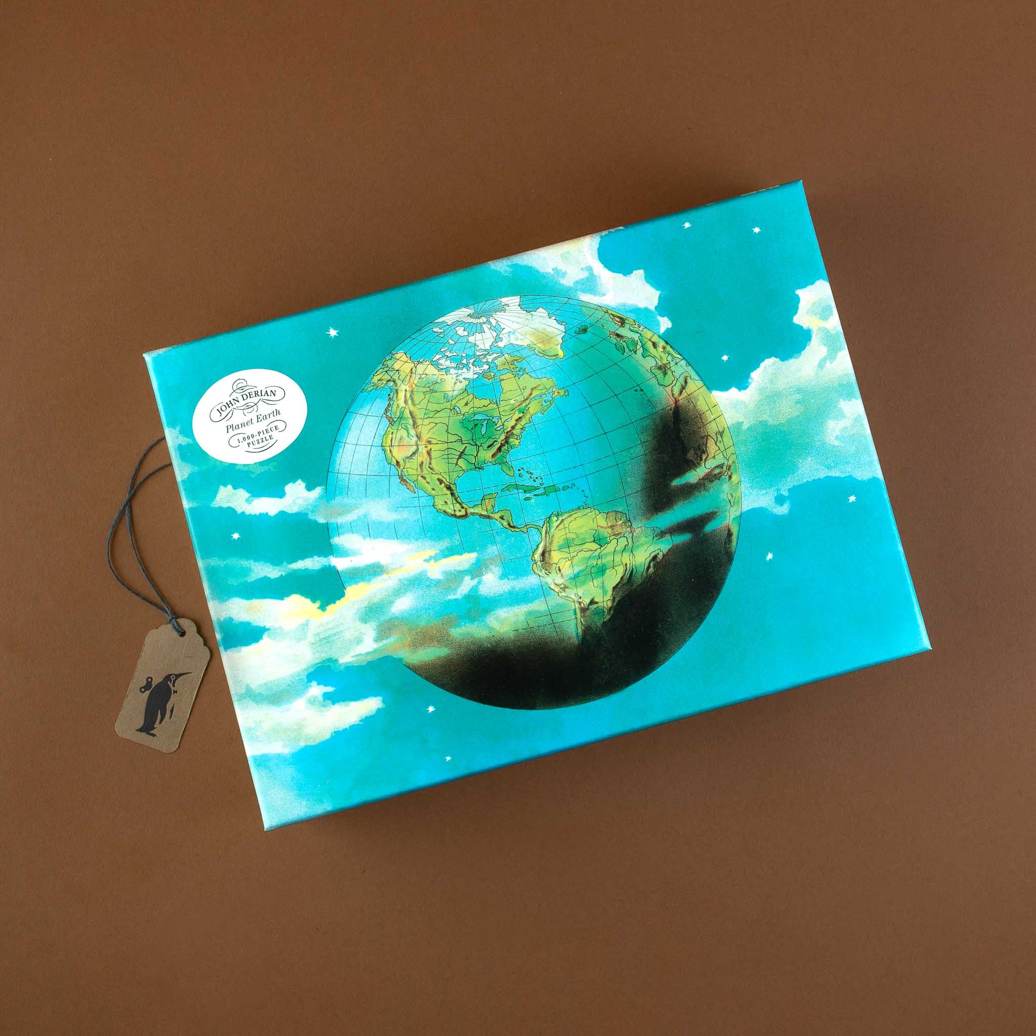 john-derian-paper-goods-planet-earth-1000-piece-puzzle-box-with-globe-floating-in-starry-sky