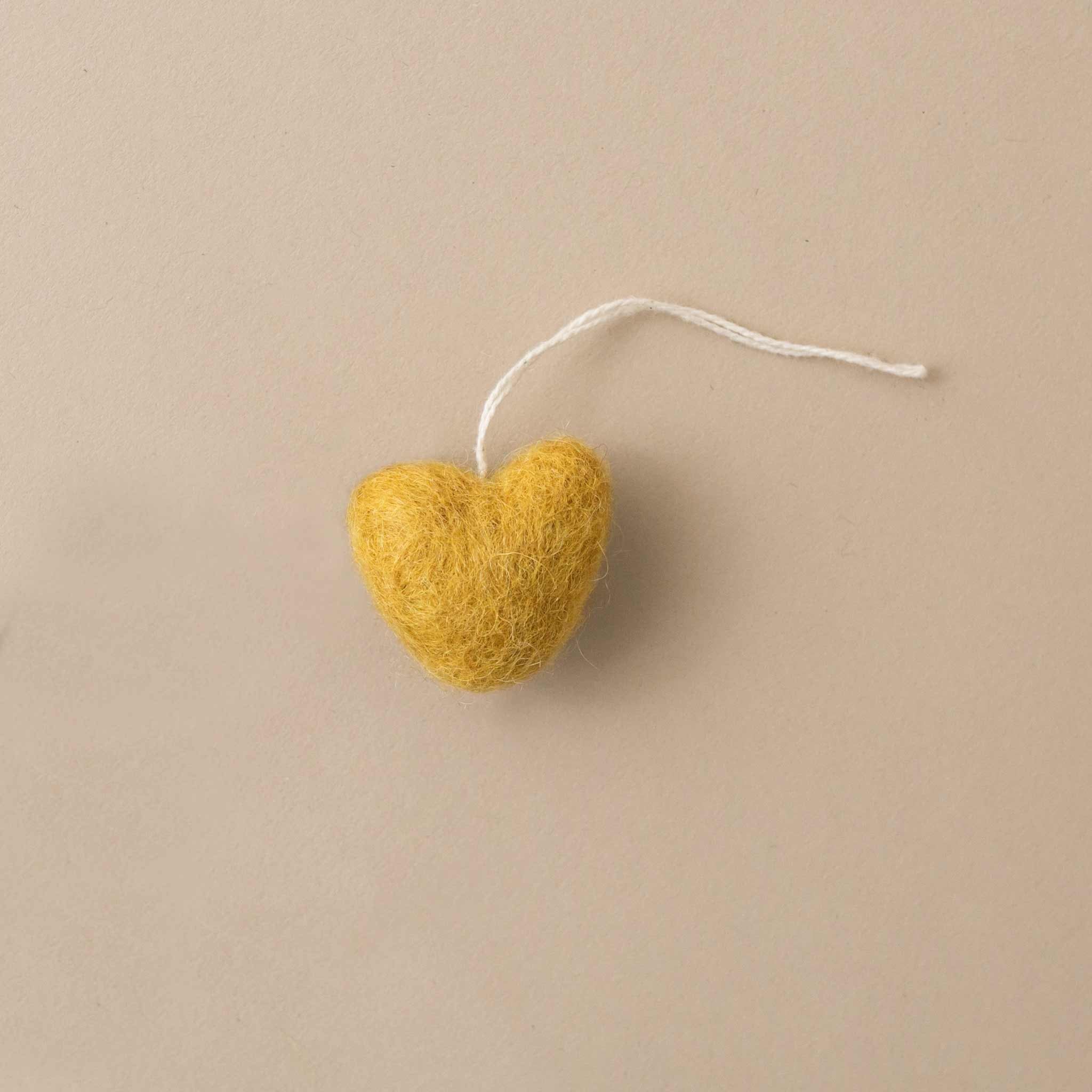 little-felted-heart-ornament-ochre-yellow